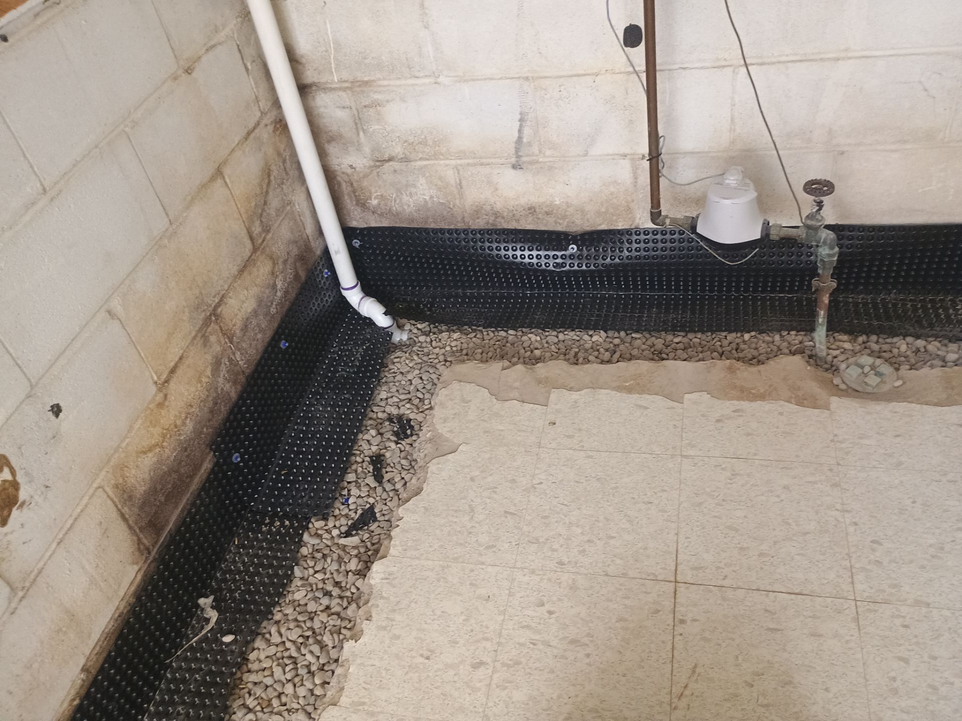 Interior Drain Tile Installation in Columbia Heights, MN by Waterproofing Northeast