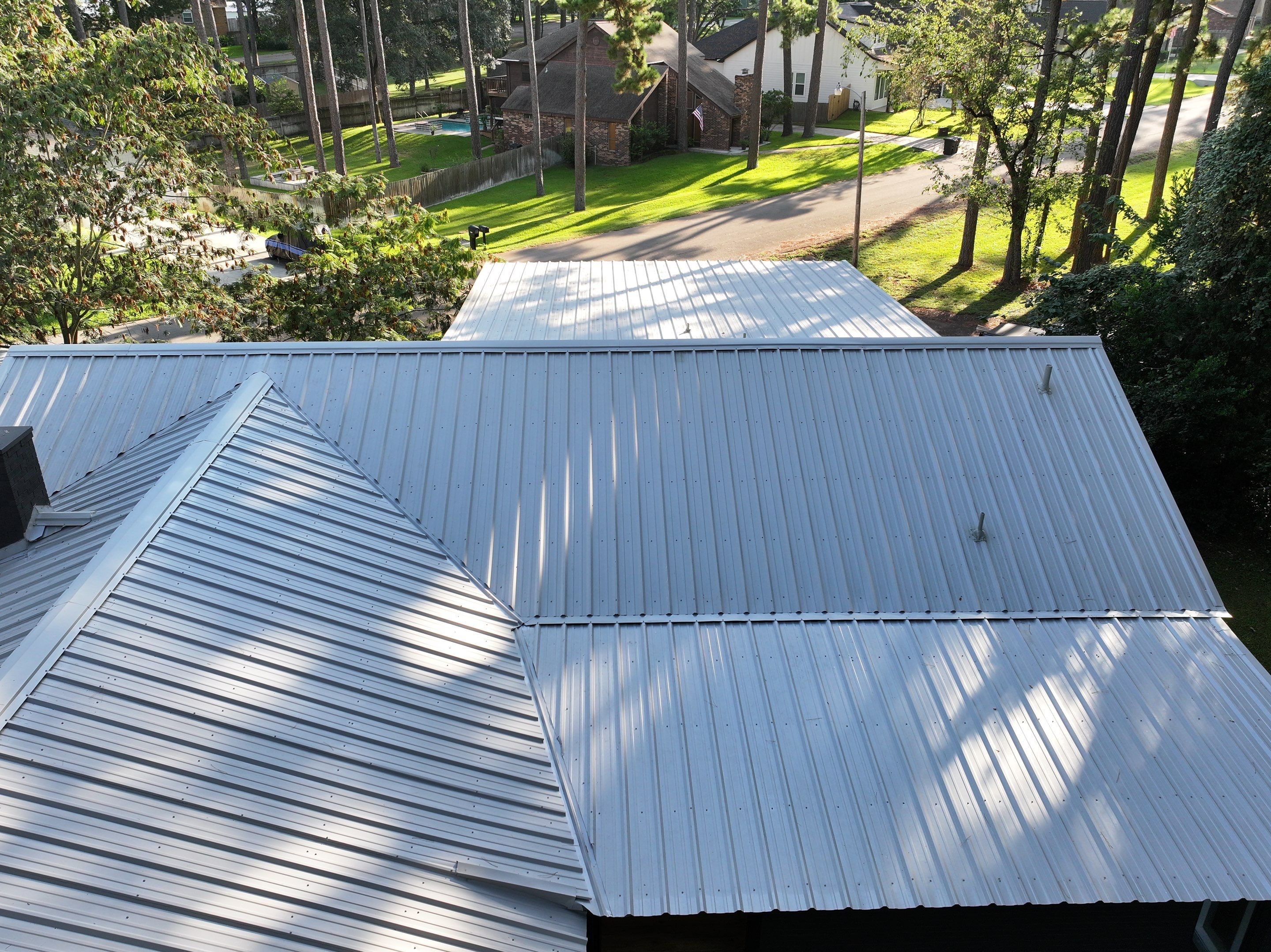 White Standing Seam Metal Roof Replacement in Willis, Texas by Abbott Roofing Company
