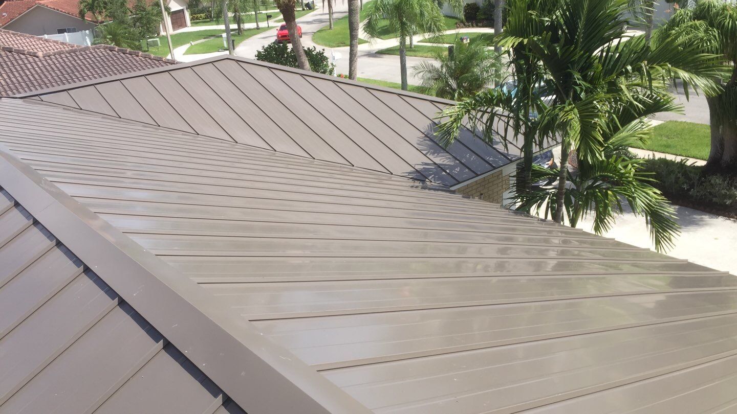 Residential Roofing Installation using 1" Nail strip metal roof by BLUES BROTHERS CONSTRUCTION CORP