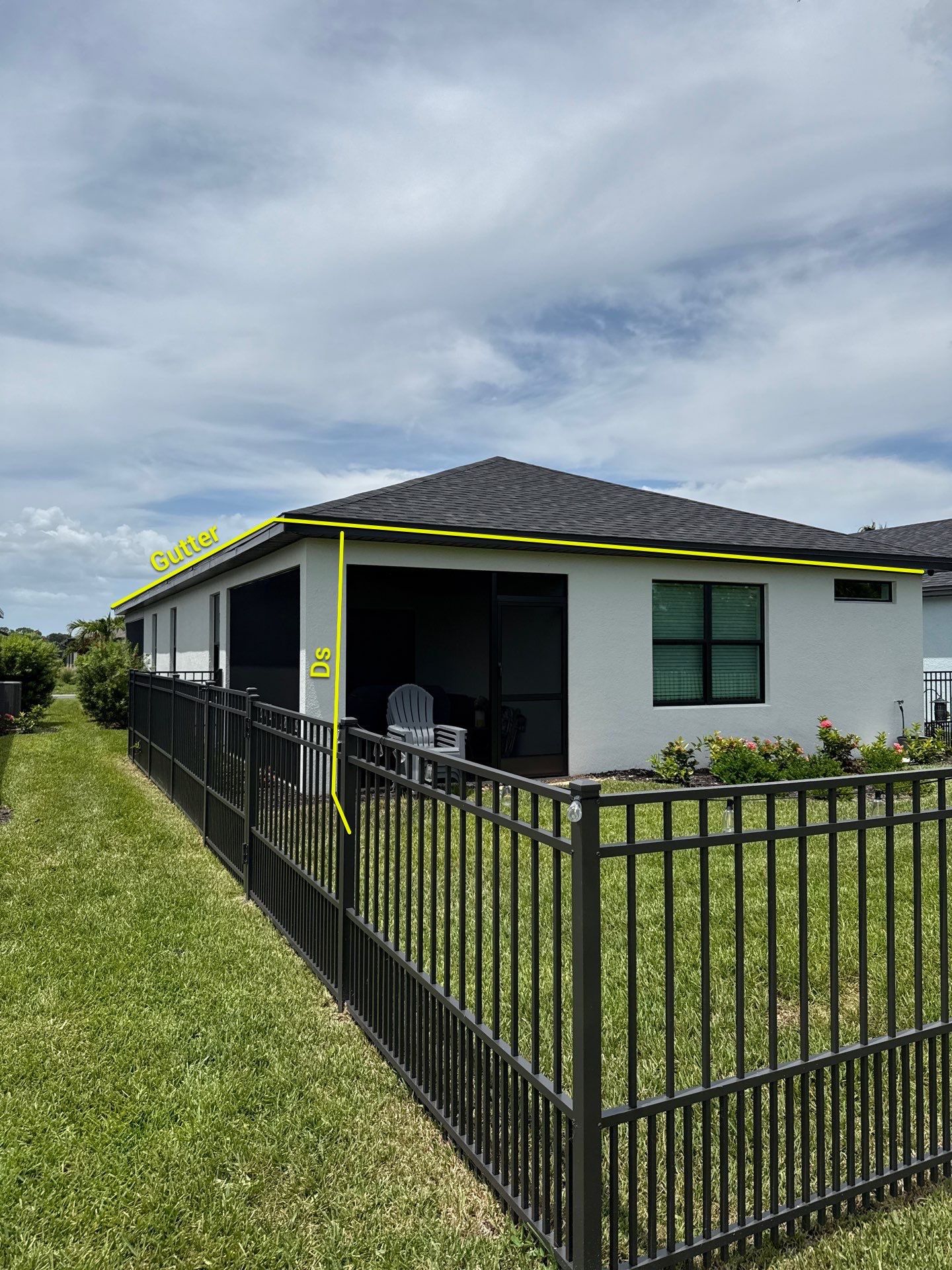 Dark Bronze Gutters and White Downspouts in Sarasota FL by Gutter Professors
