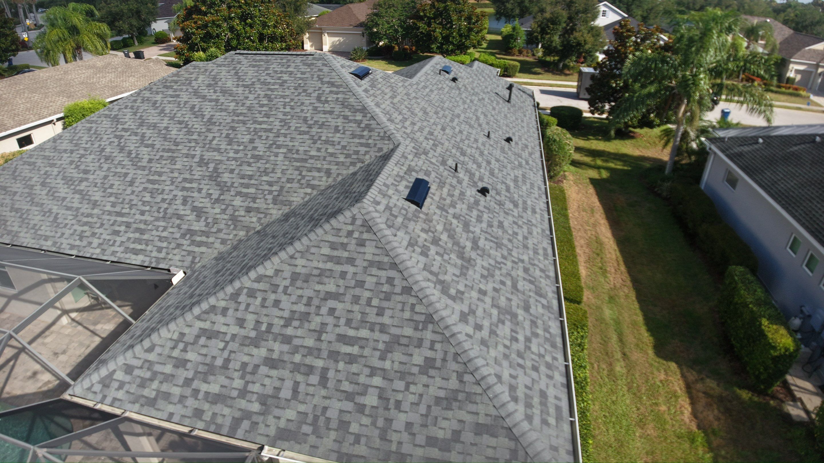 Residential Roof Installation With Estate Grey Architectural Shingles in Bradenton by Trinity Restoration and Roofing LLC