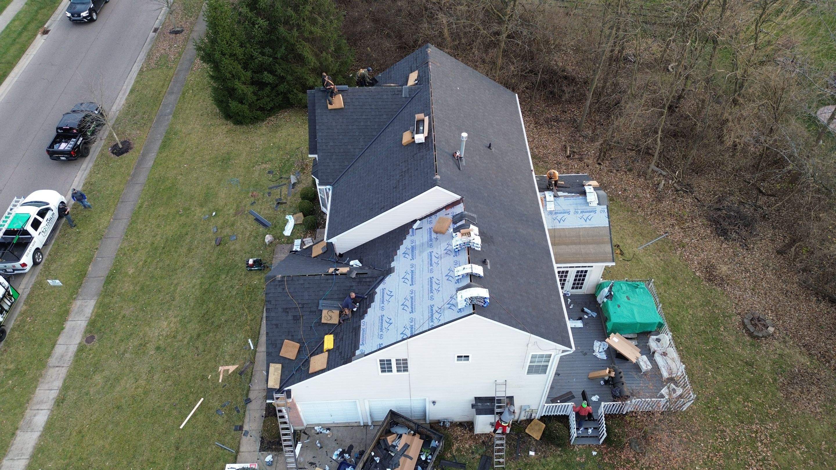 Walden Ponds - Pristine Black and Hydro Flo Gutter Guards by Tamlin Roofing