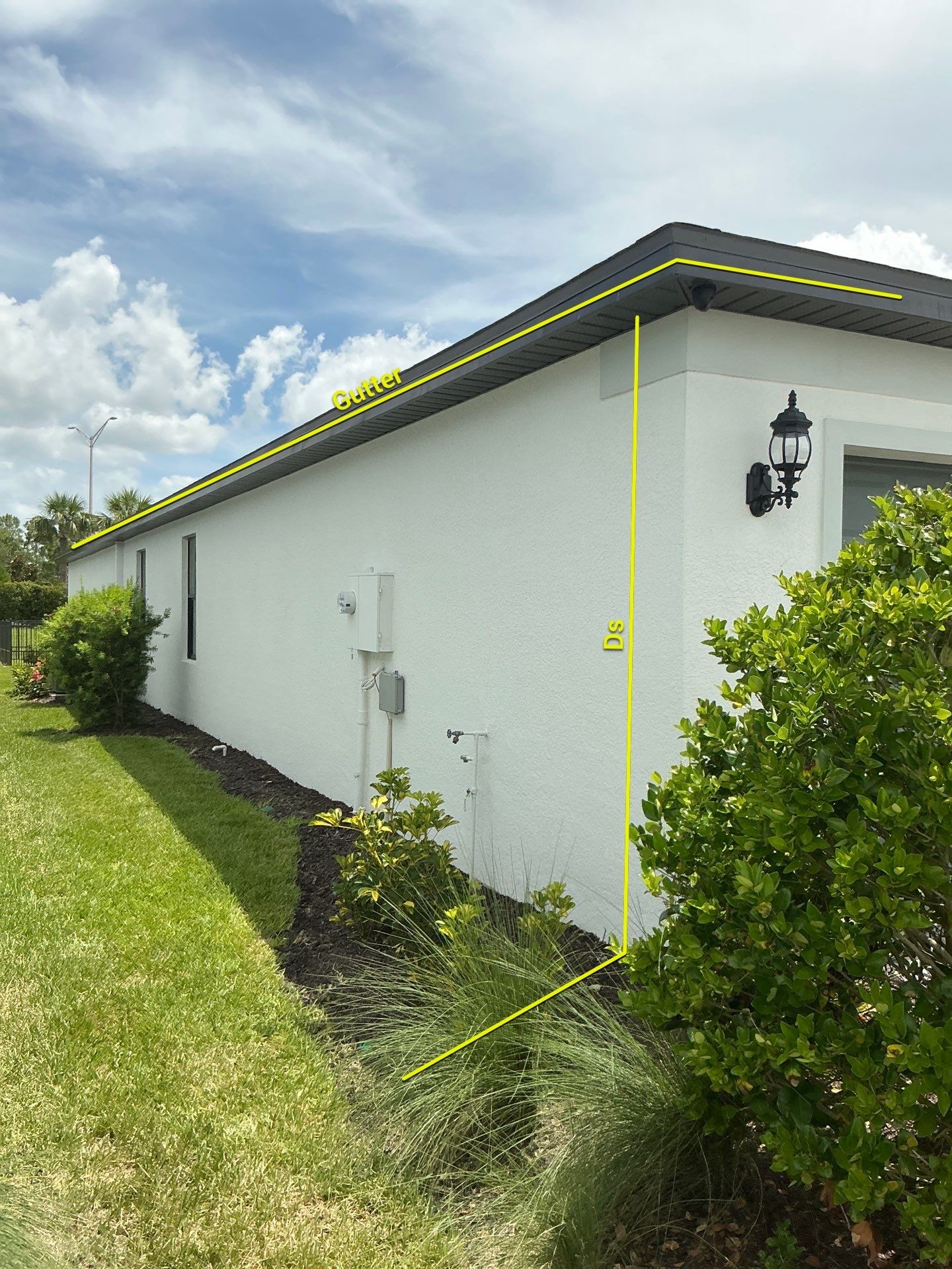 Dark Bronze Gutters and White Downspouts in Sarasota FL by Gutter Professors