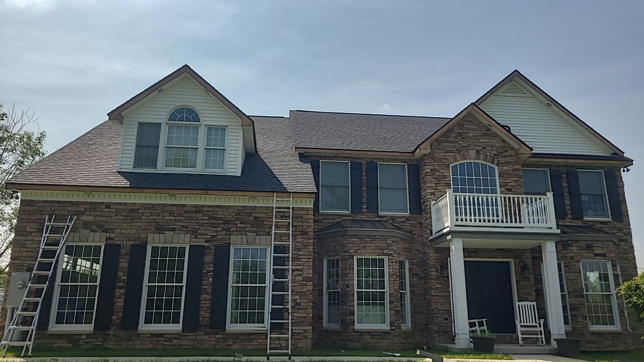 Roof Damage using Certainteed Lifetime Roofing System- Moire Black Landmark Pro shingkes with shadow ridge caps. by BulletpROOF Exteriors