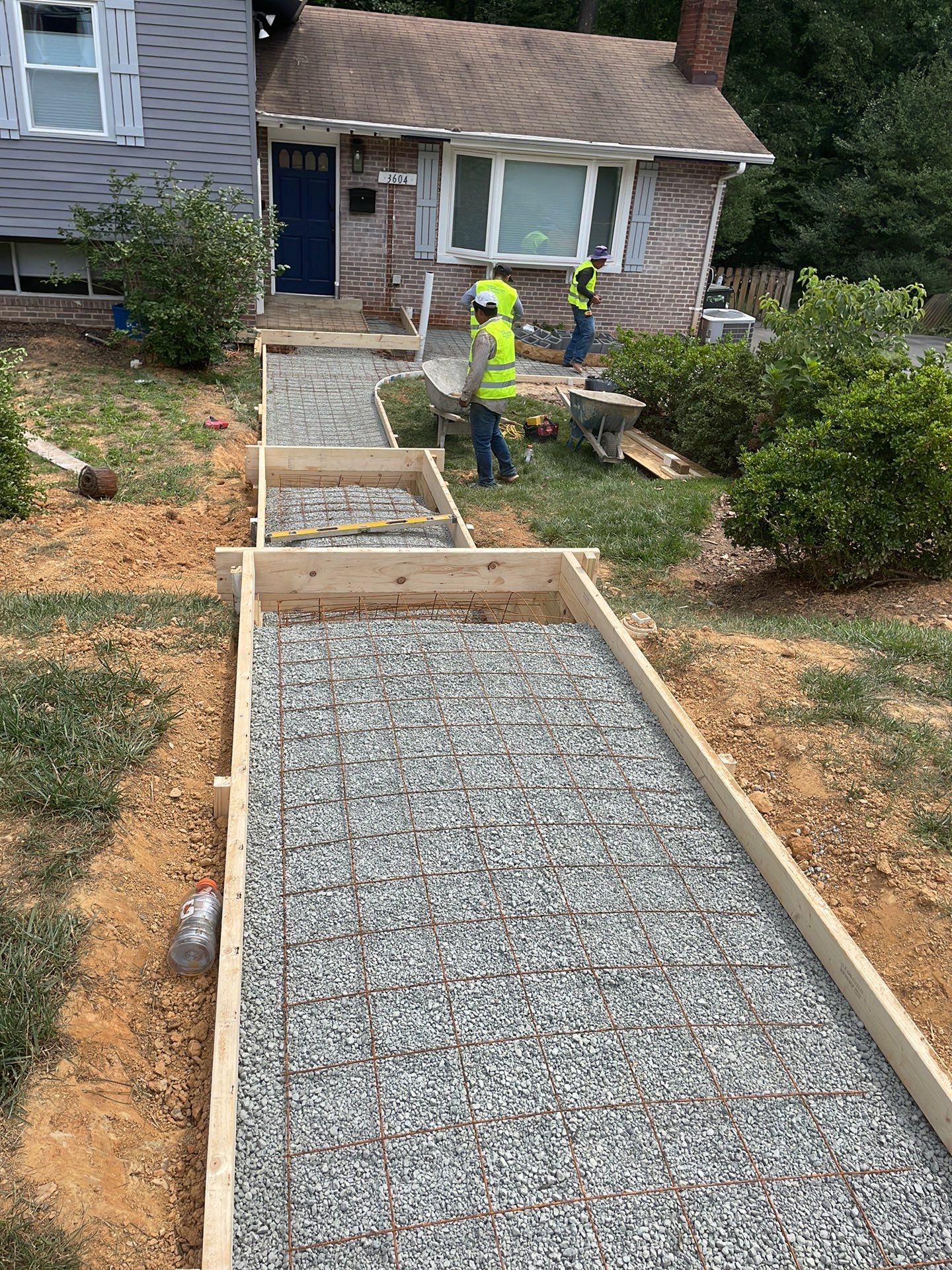 New walkway with stairs and a new front porch by Fairfax Contractors, LLC