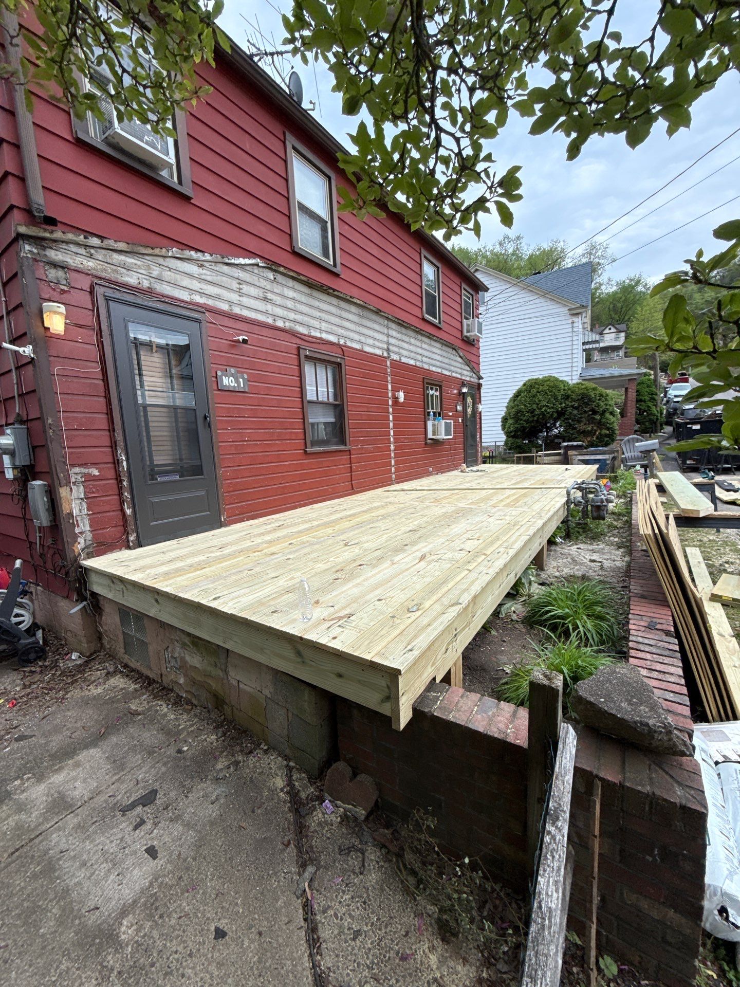 Roof sunspace deck  by Cousins Roofing Siding & Decks