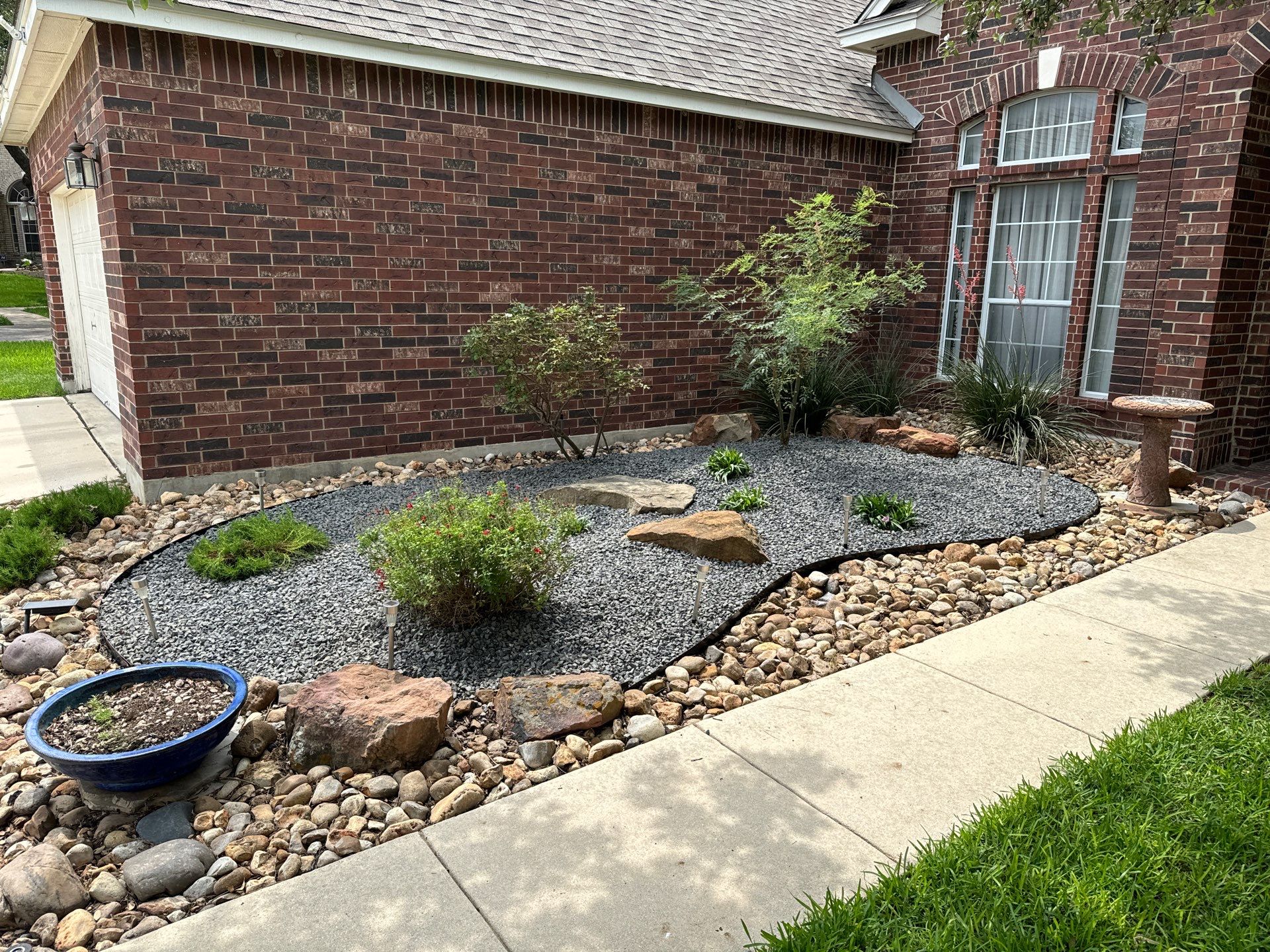 Landscaping Enhancement  using Texas Black Gravel by Hole In One Lawns, LLC
