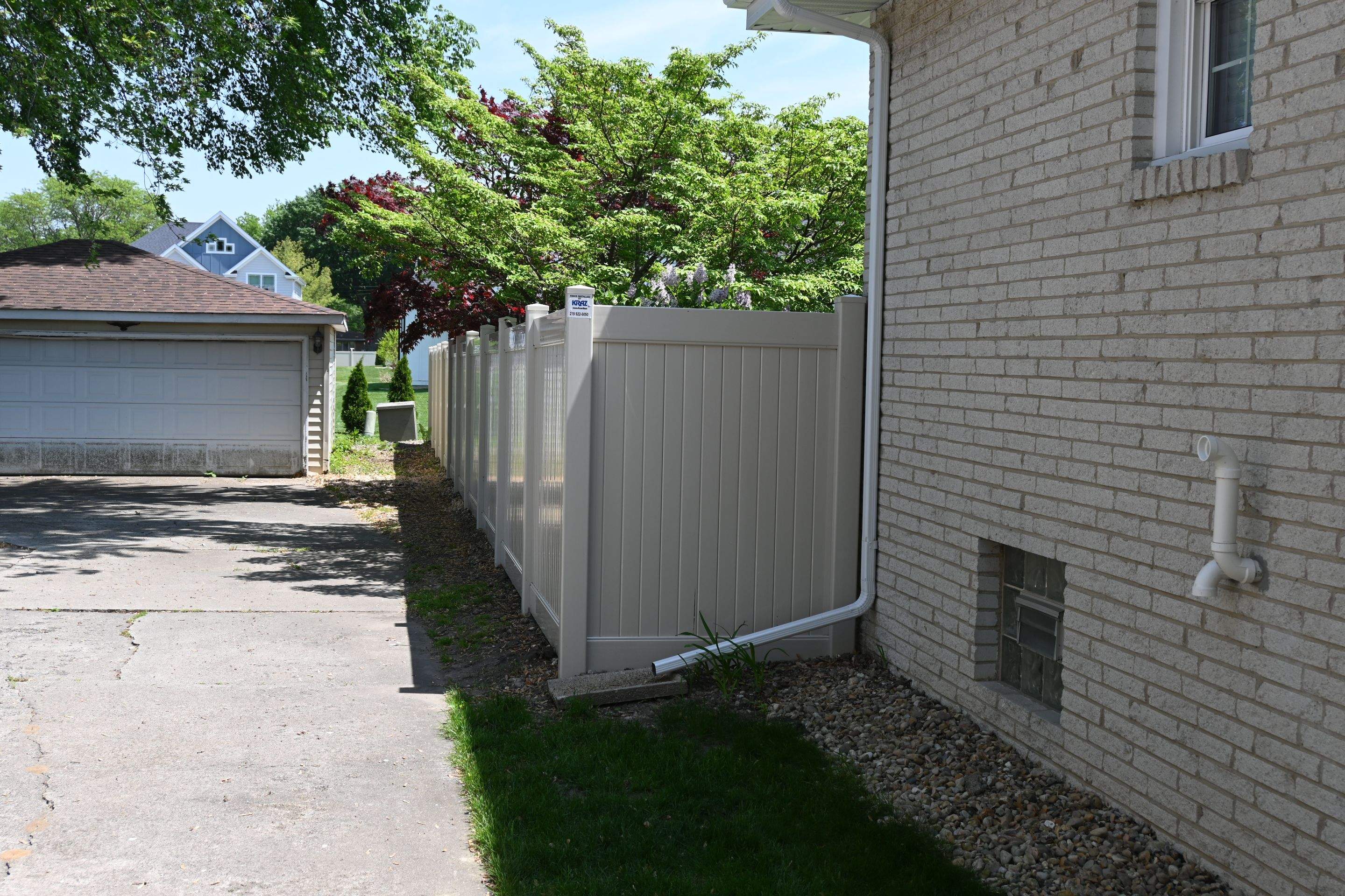 Vinyl Fence Installation in Backyard by Kraz Construction