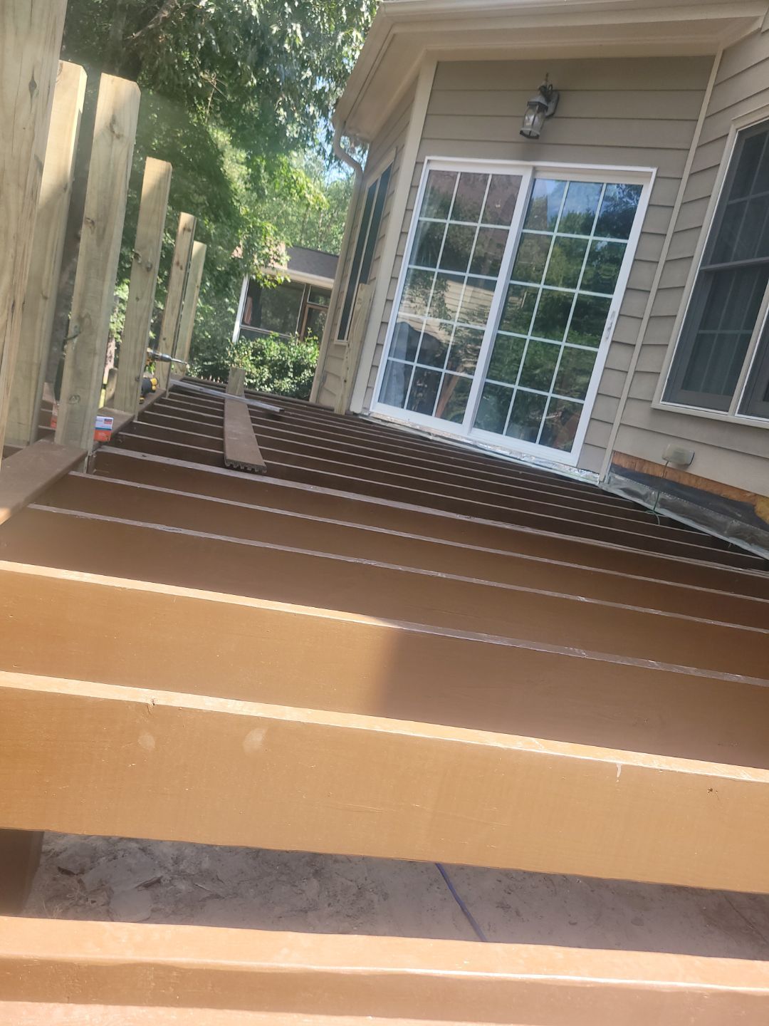 Fuquay-Varina Outdoor Upgrade – Composite Deck & Paved Landing by Elite Remodeling and Design LLC