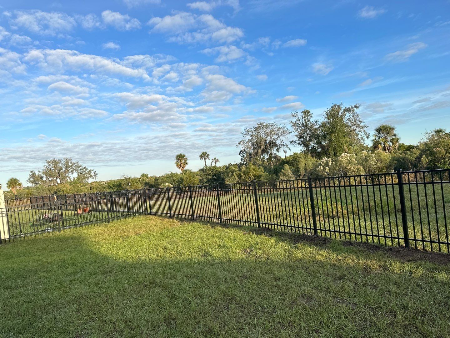 Vinyl Fence Installation using Vinyl Fence and a Black 3 Rail Aluminum Fence by Asap fence and gates, LLC