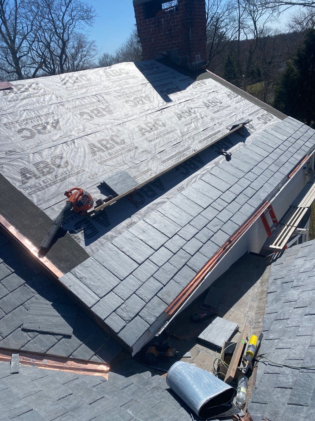 Residential Roofing Installation using Vermont Slate by A Plus Exterior