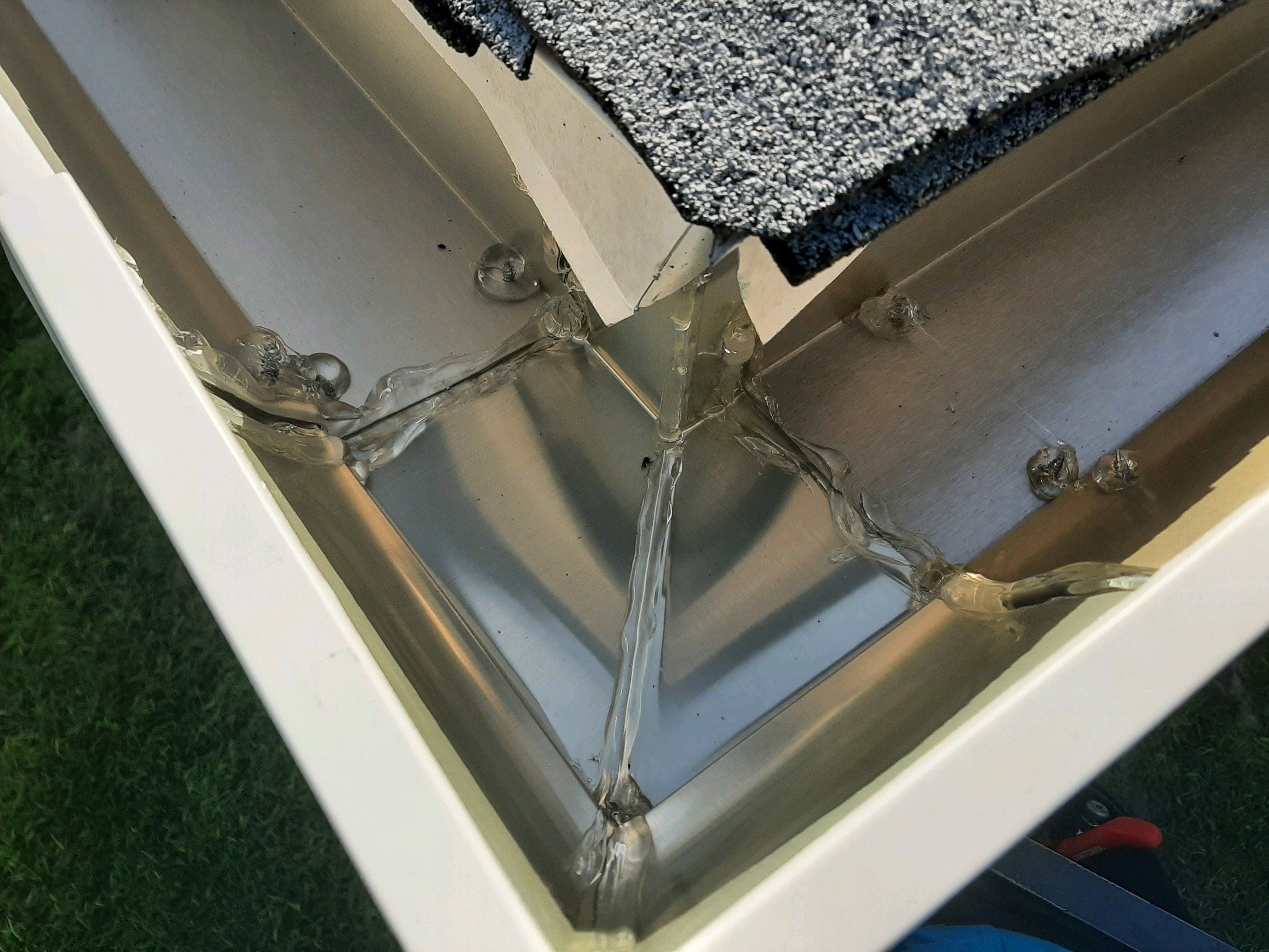 Seamless Gutter Installation using White by Gutter Professors