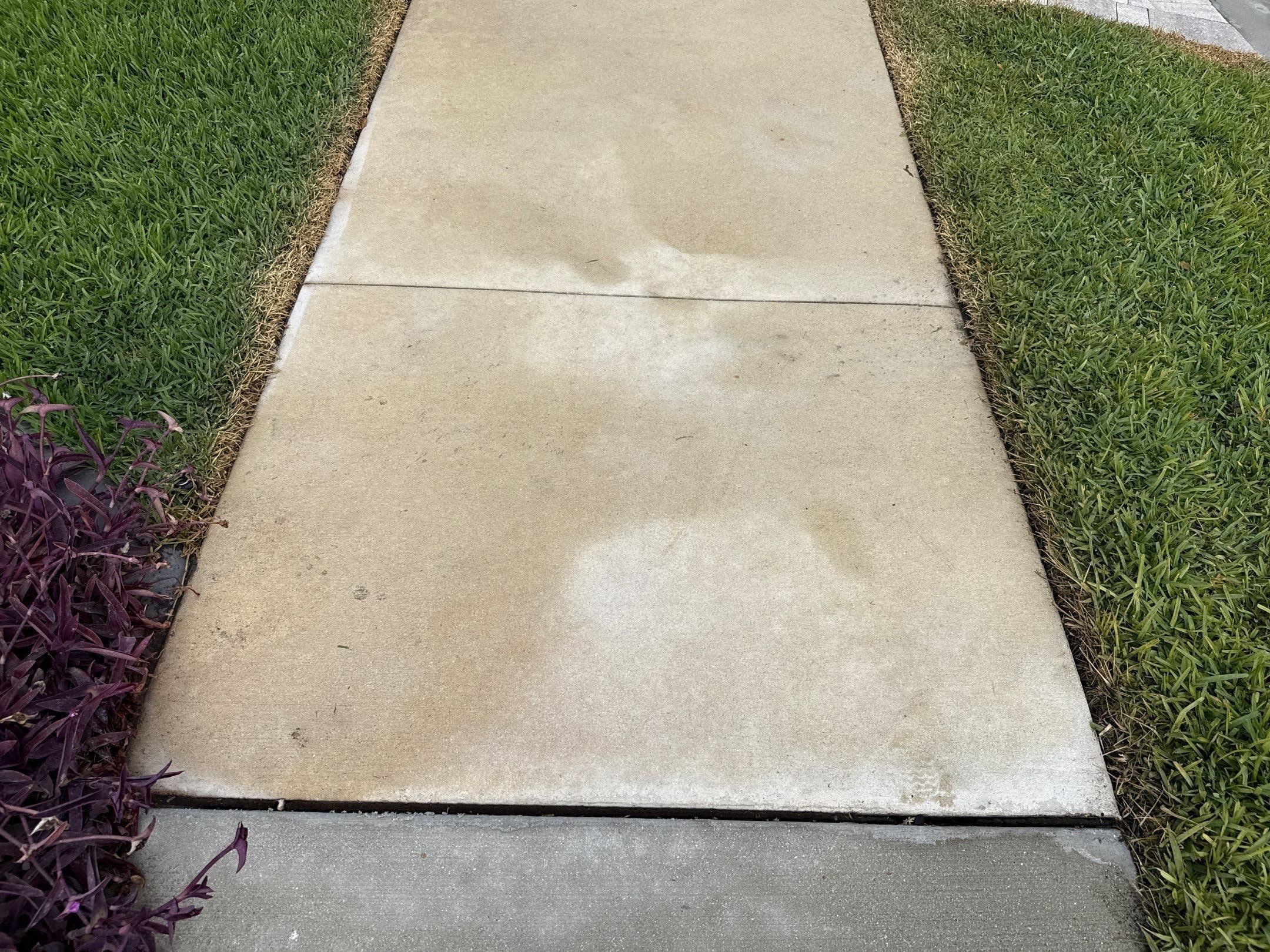 Rust Stain Removal from Concrete Driveway and Pavers in Park East at Azario | Lakewood Ranch, FL by Sunshine AquaWash