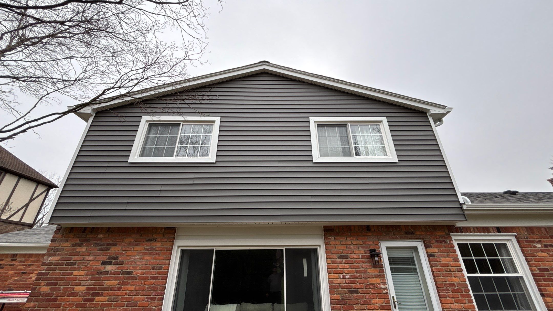 Siding Replacement using Alside Charcoal Smoke and Roof Replacement using Owens Corning Peppercorn by 180 Contractors