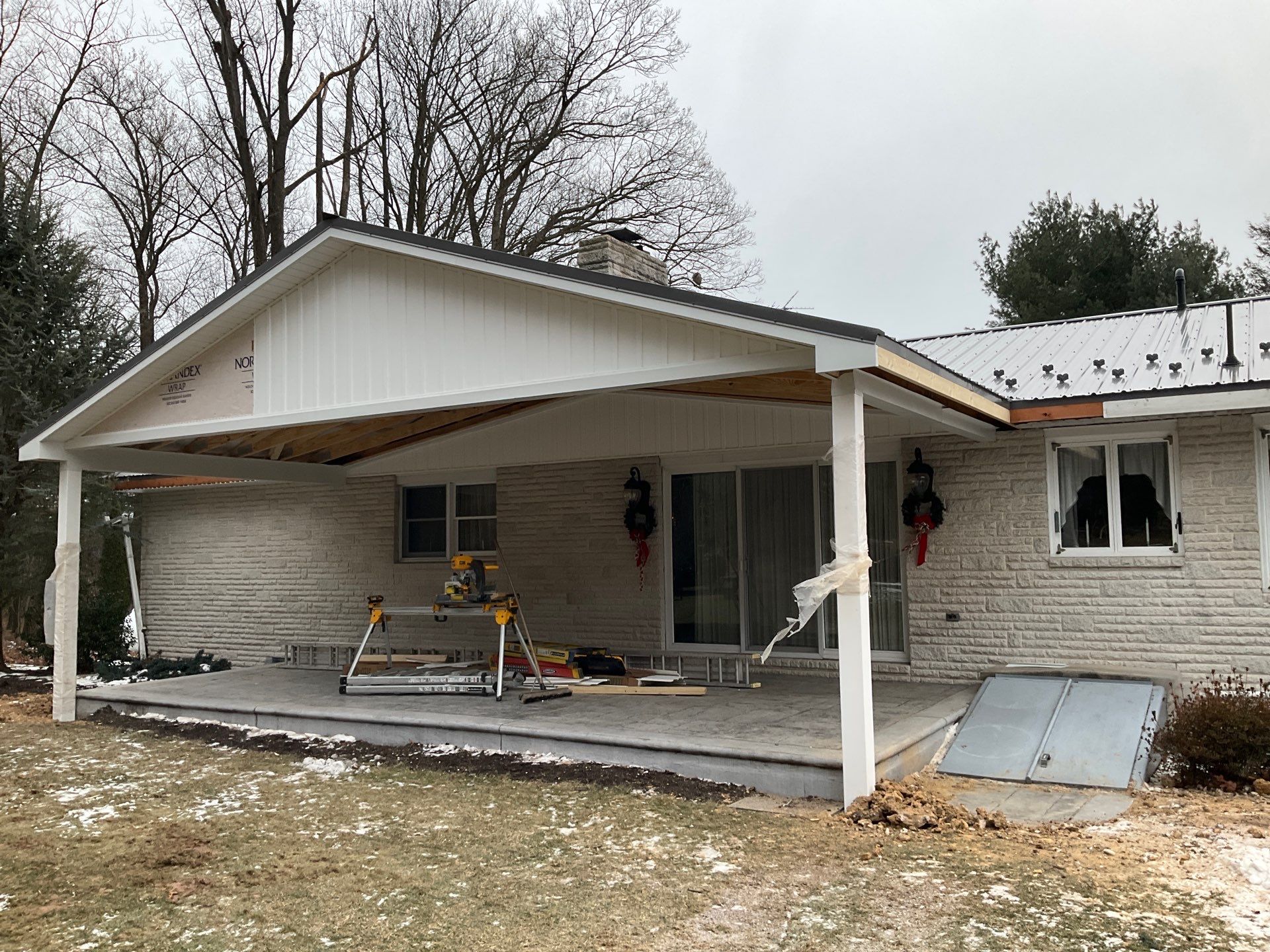 Metal Roof and Gabled Porch Addition in Hegins by Esh Builders