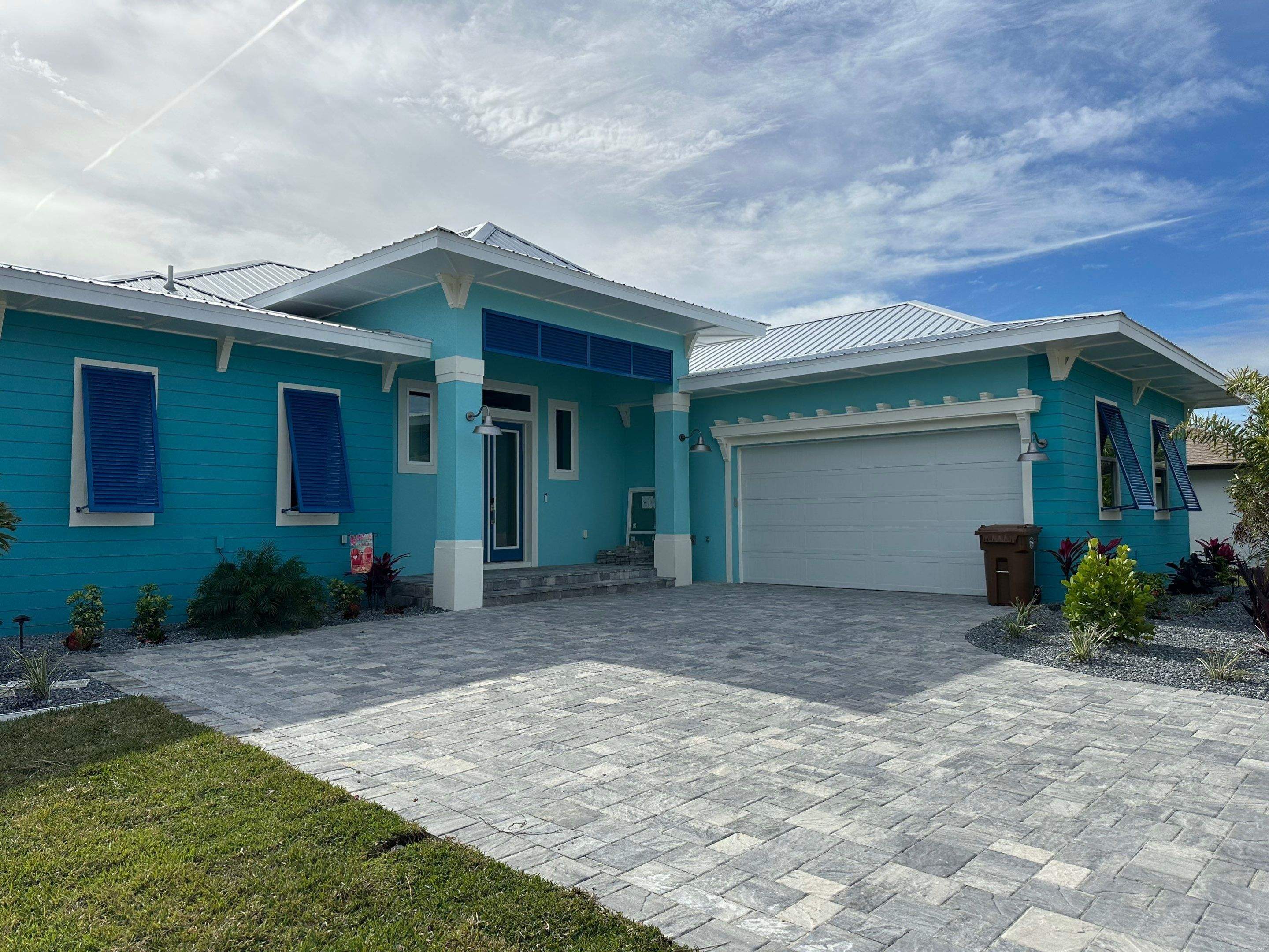 Bahama Shutters in Capri Blue by Smart Guard Shutters
