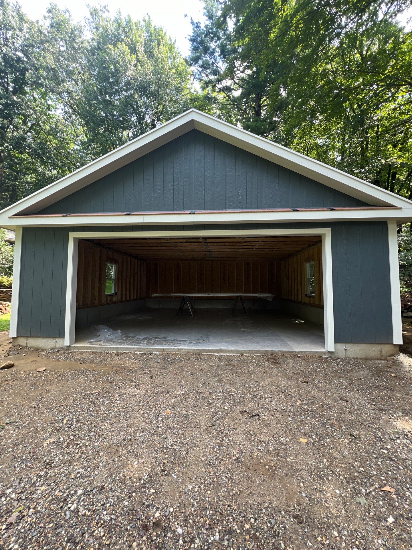 Garage using LP SmartSide Panel Siding by Chagnon Building & Remodeling LLC