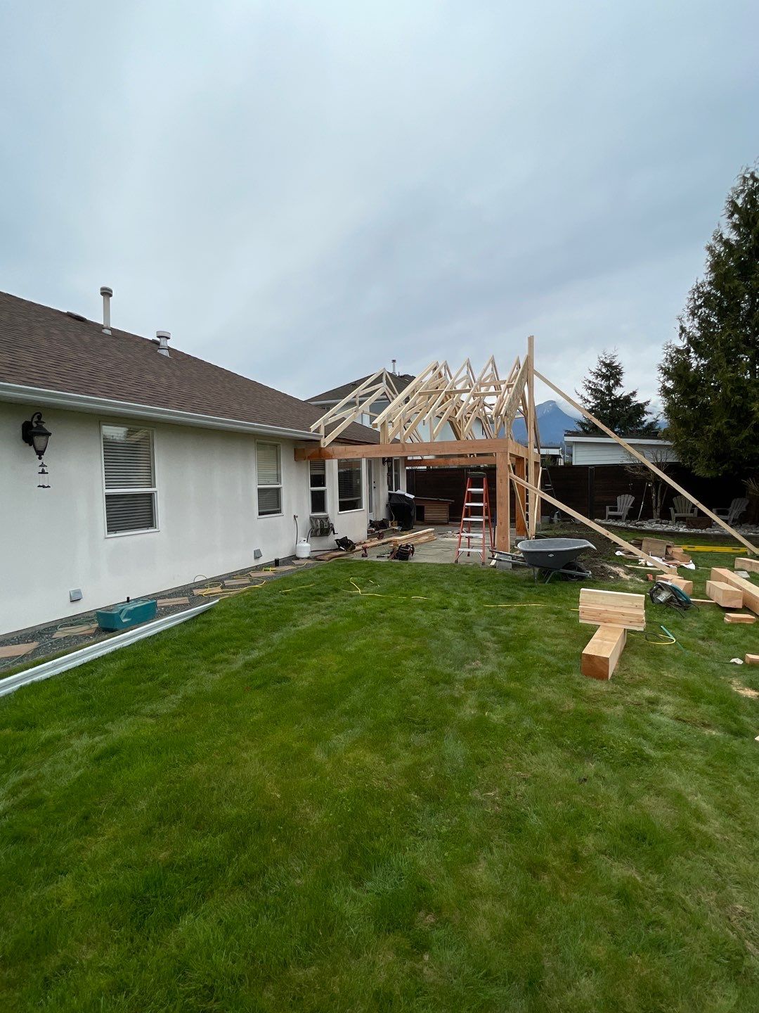 Residential patio roof extension with IKO Dual Brown shingles by Top Notch Roofing Inc