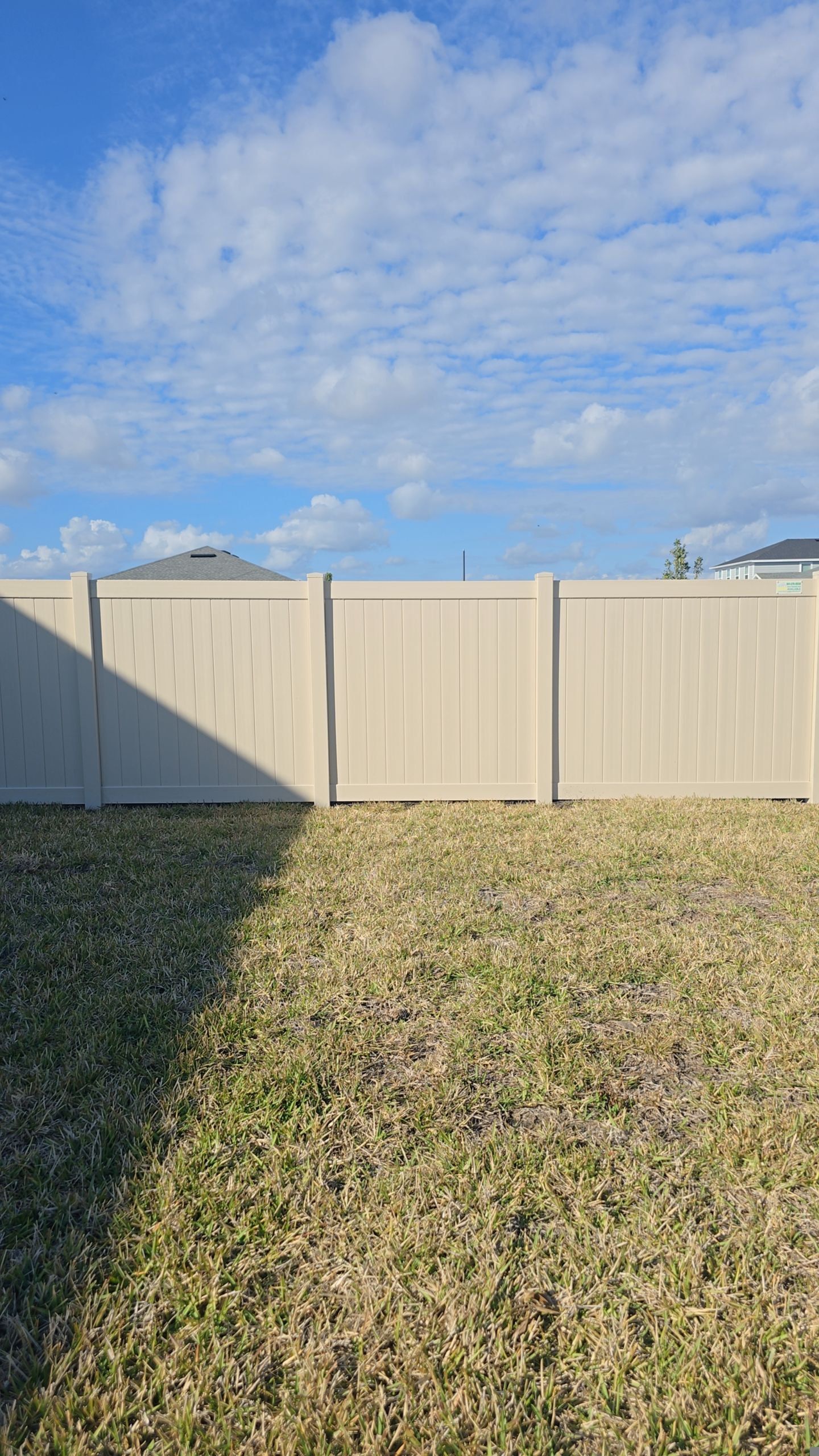 Tan Vinyl Fence in West Port by True Fence LLC