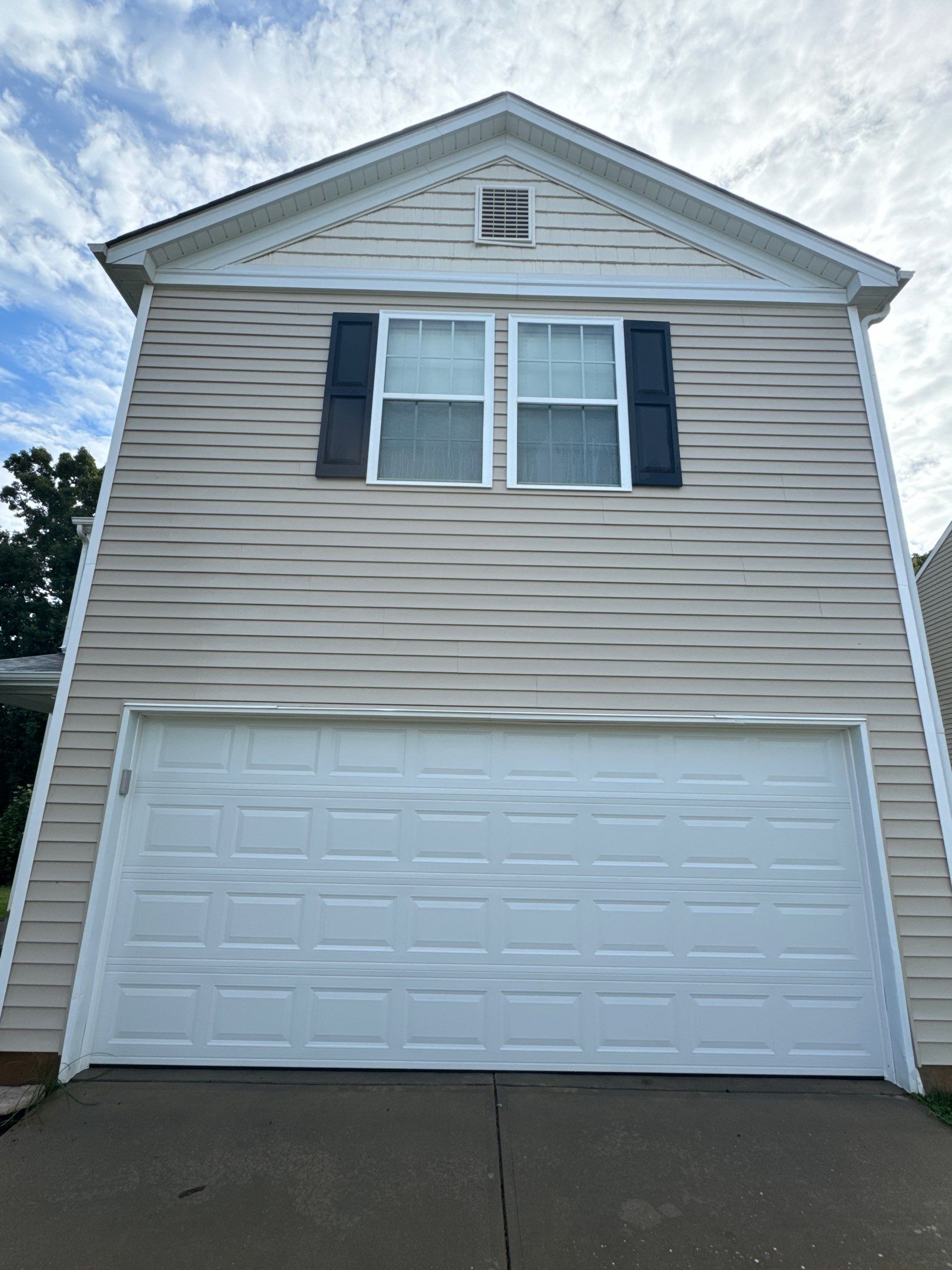 the service involves cleaning the vinyl siding and garage door on the house for a fresh and updated appearance