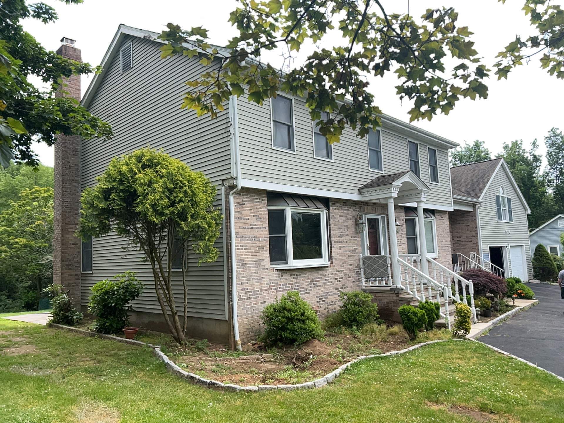Siding Installation using Mainstreet Colonial & White gutters by A Plus Exterior
