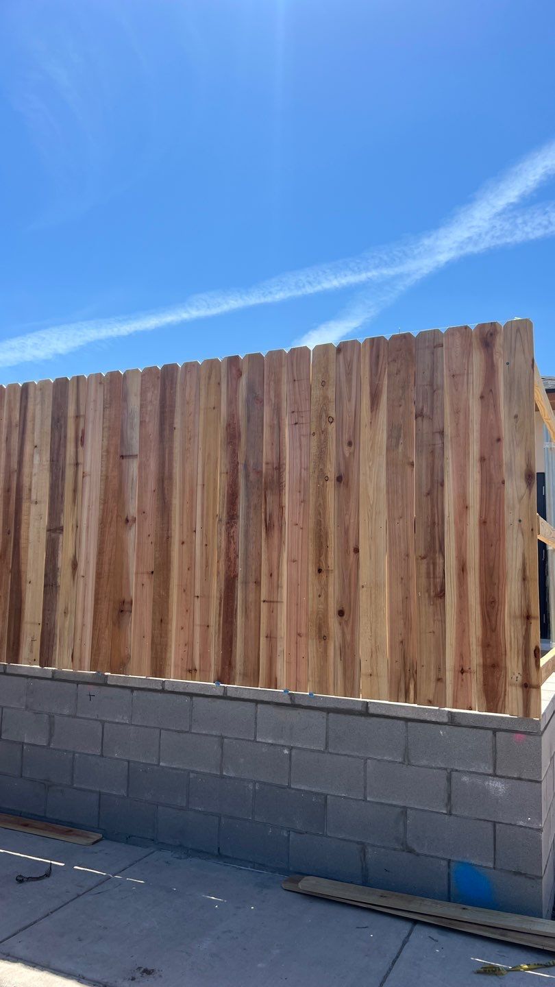 Cedar Fence using Cedar Pickets and Metal Poles by Clays Services Inc