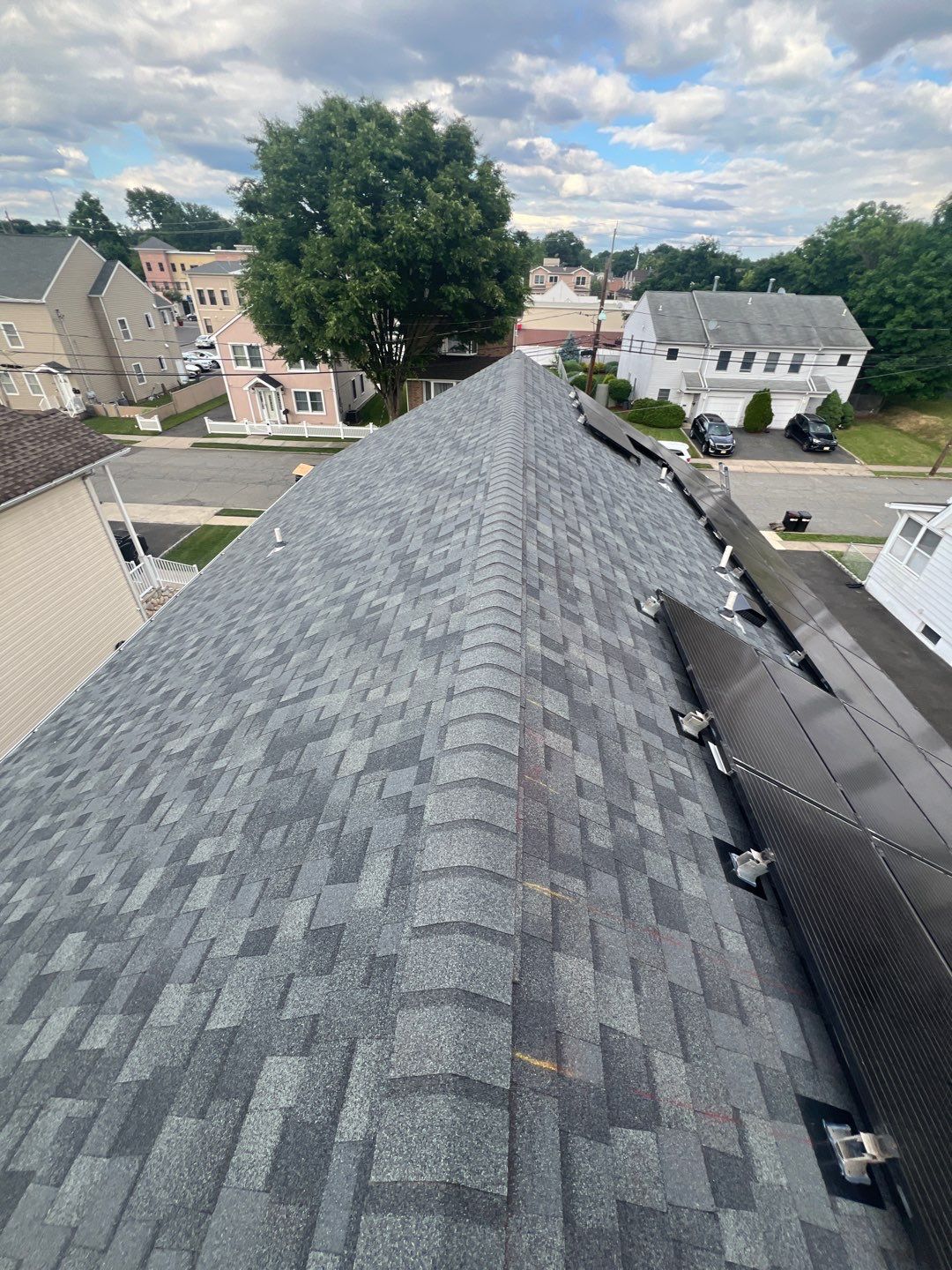 Charcoal Shingles by Reimagine Roofing