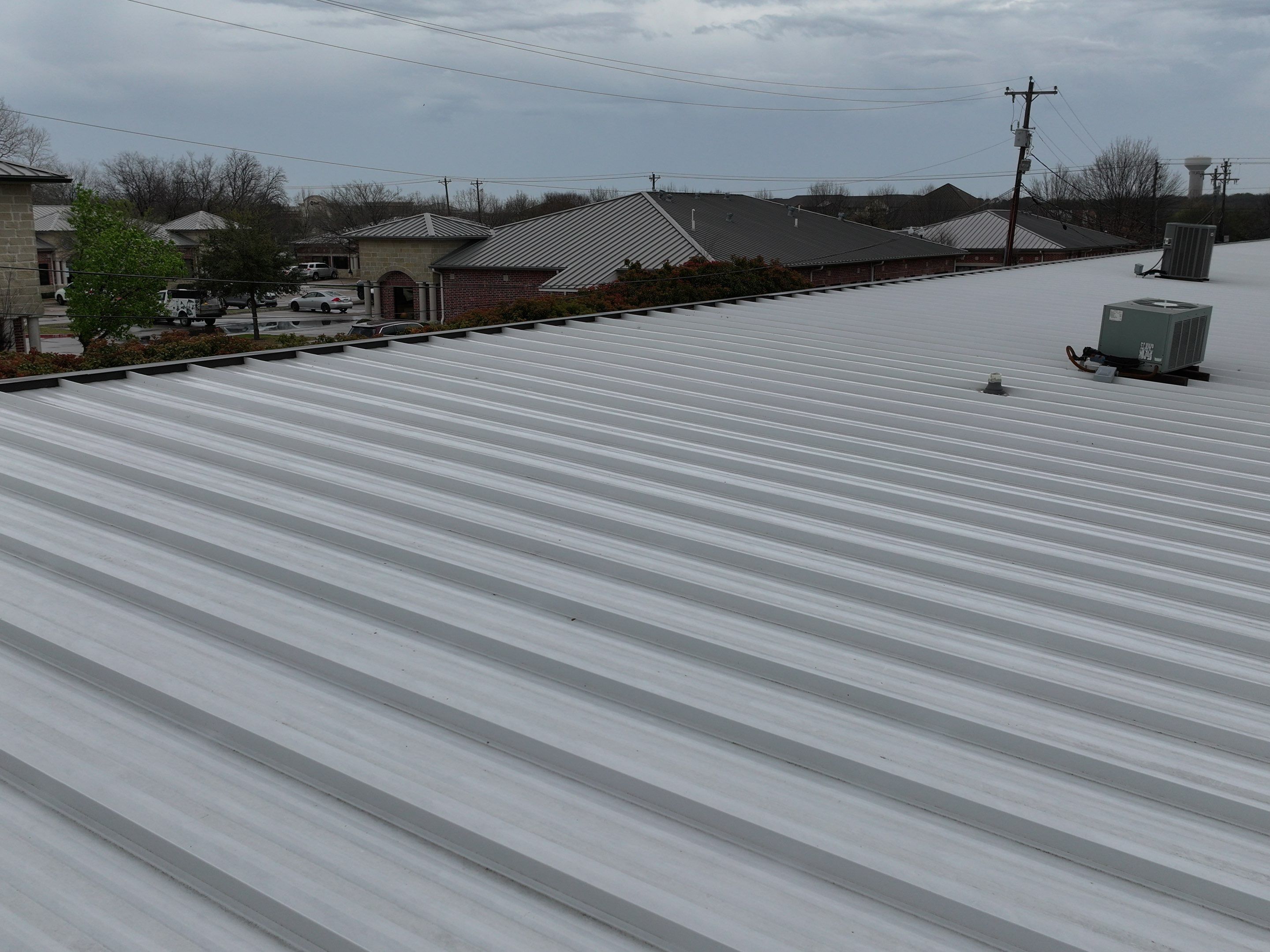 Commercial Roofing Installation using Double lock Mechanical Standing Seam Metal by Becker Roofing and Exteriors
