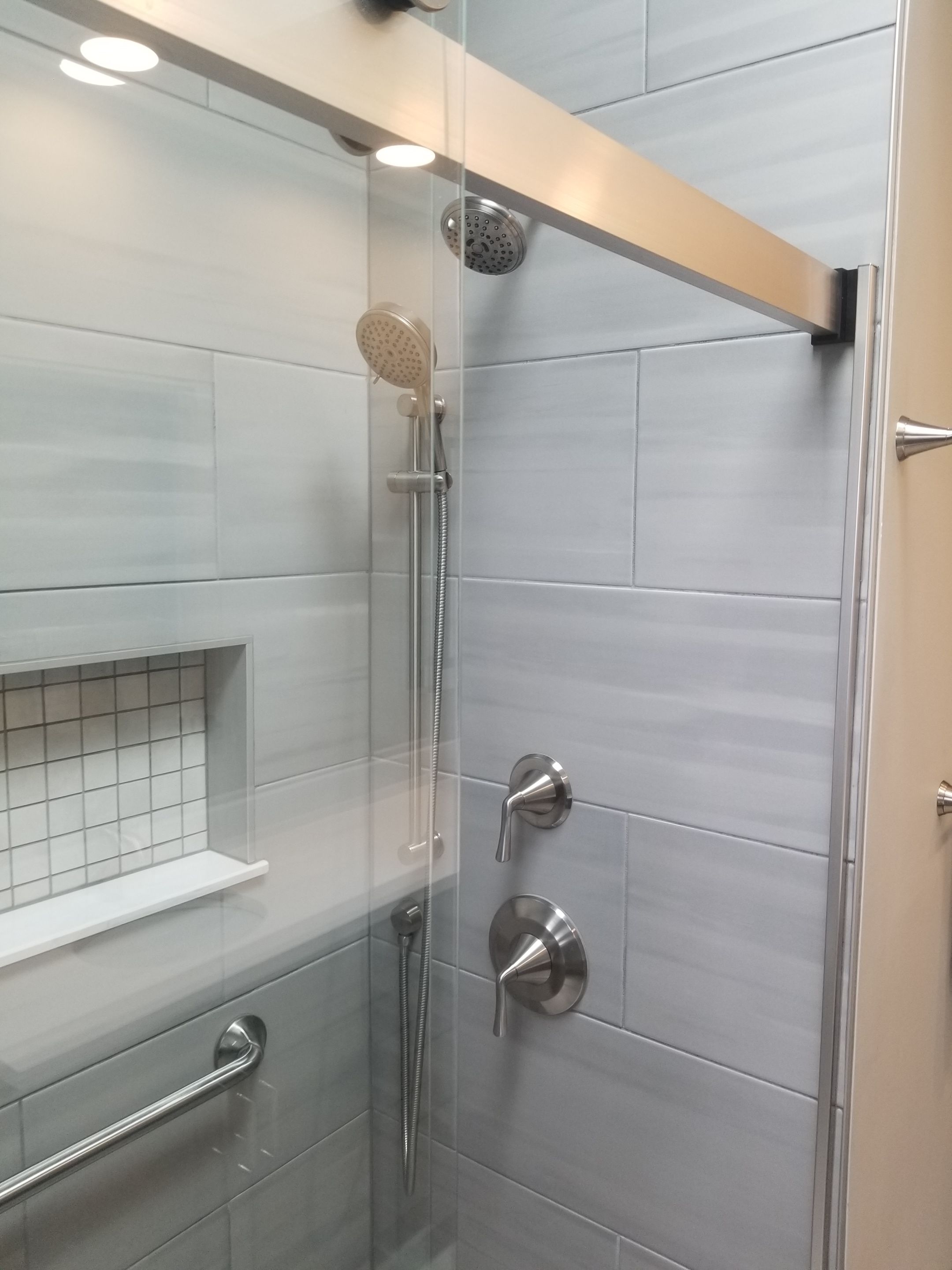 Remodel full bathroom new tile walk in shower plus 2nd half bath Powder room in Livonia, MI by Northwest Construction