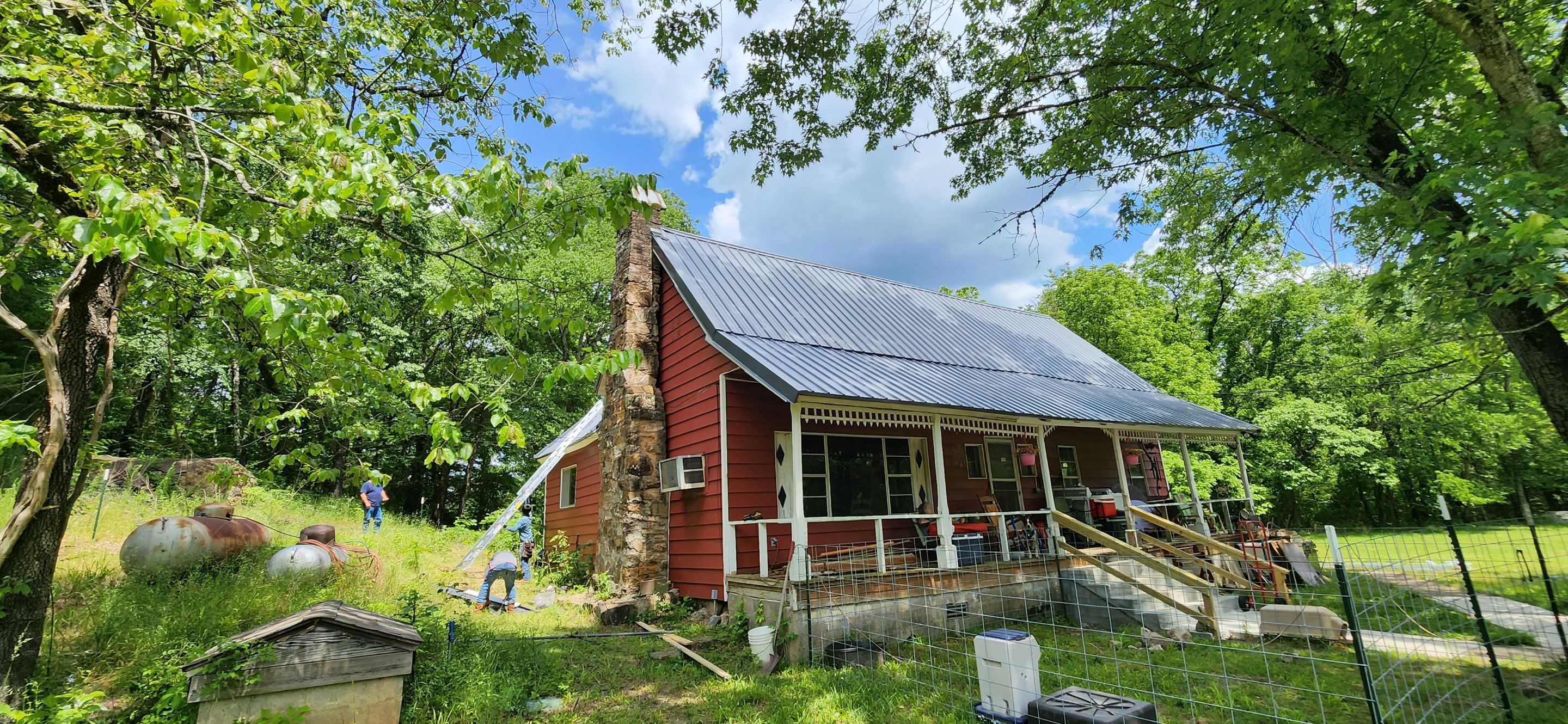 Residential Roofing Installation using 26 Gauge Colored Panels by Hostetler Roofing