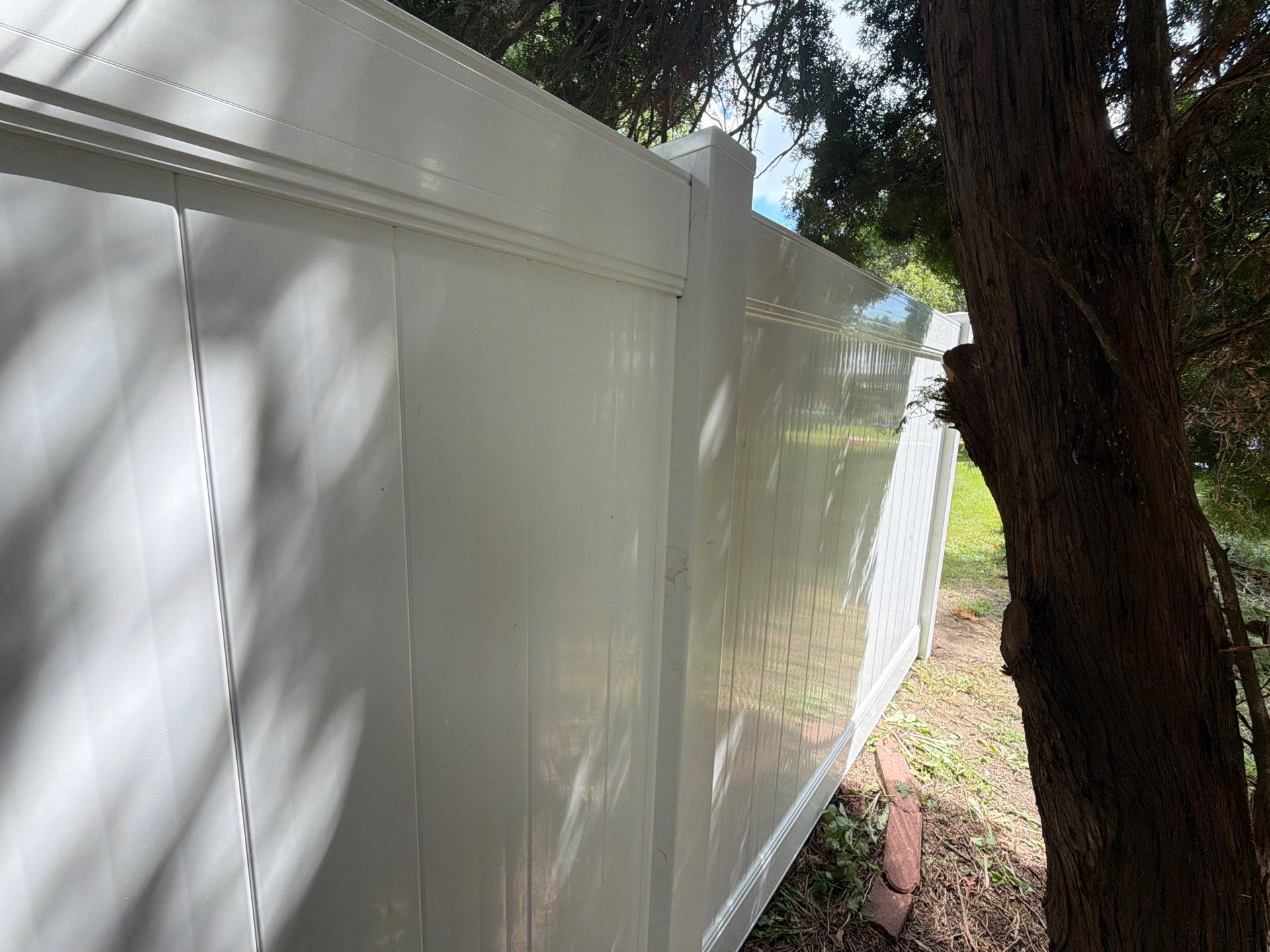 Residential White Vinyl Privacy and Black Chain Link Fencing in Jesup by Perfect Picket Fence and Stain