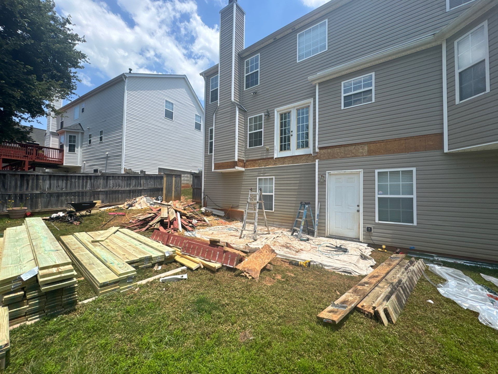 Backyard Deck Expansion & Custom Staircase Installation in Suwanee. by Swift Home Renovations