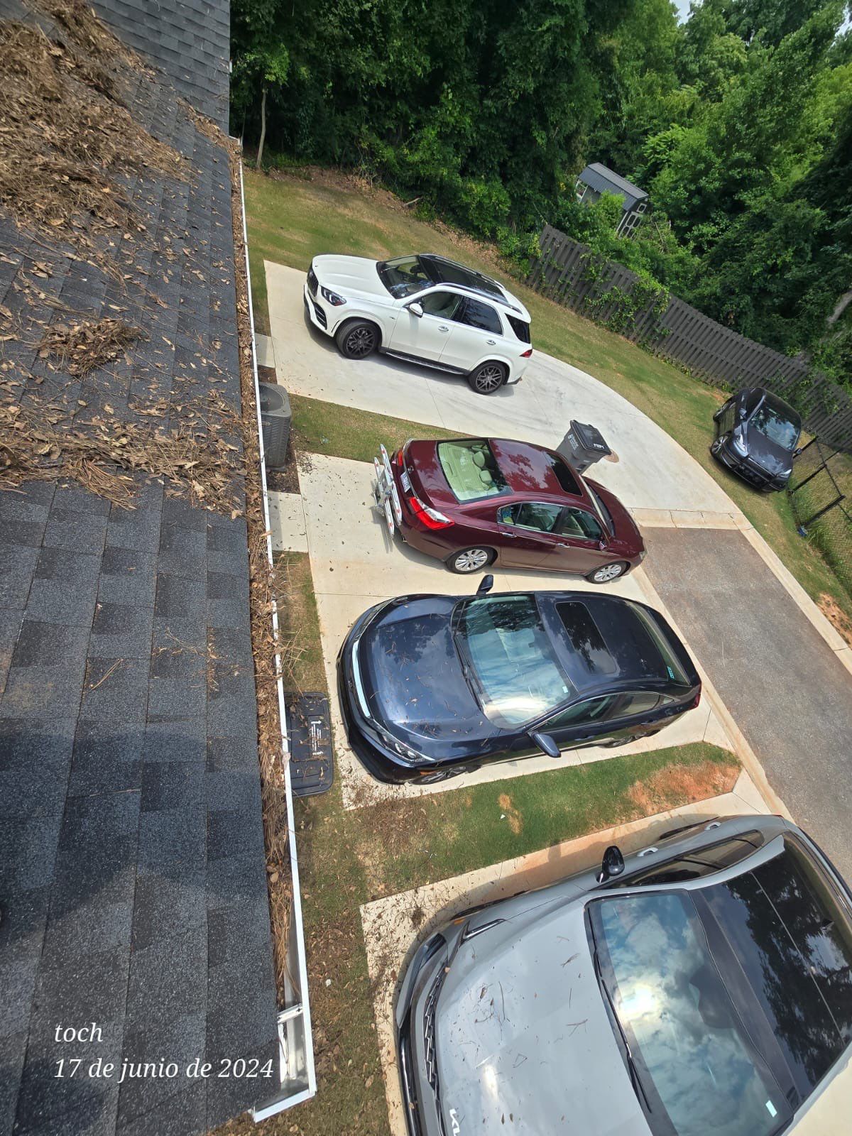 Commercial gutter cleaning Simpsonville & Easley, SC before photo with filled gutters