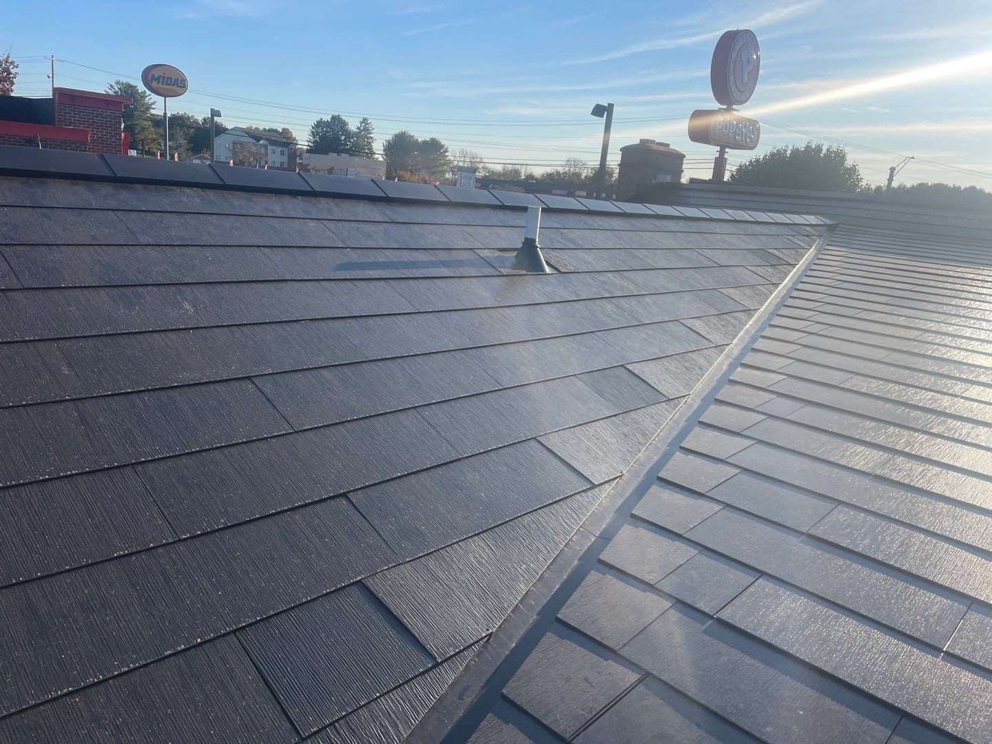 Tesla Solar Roof on a Commercial Building by American Home Contractors