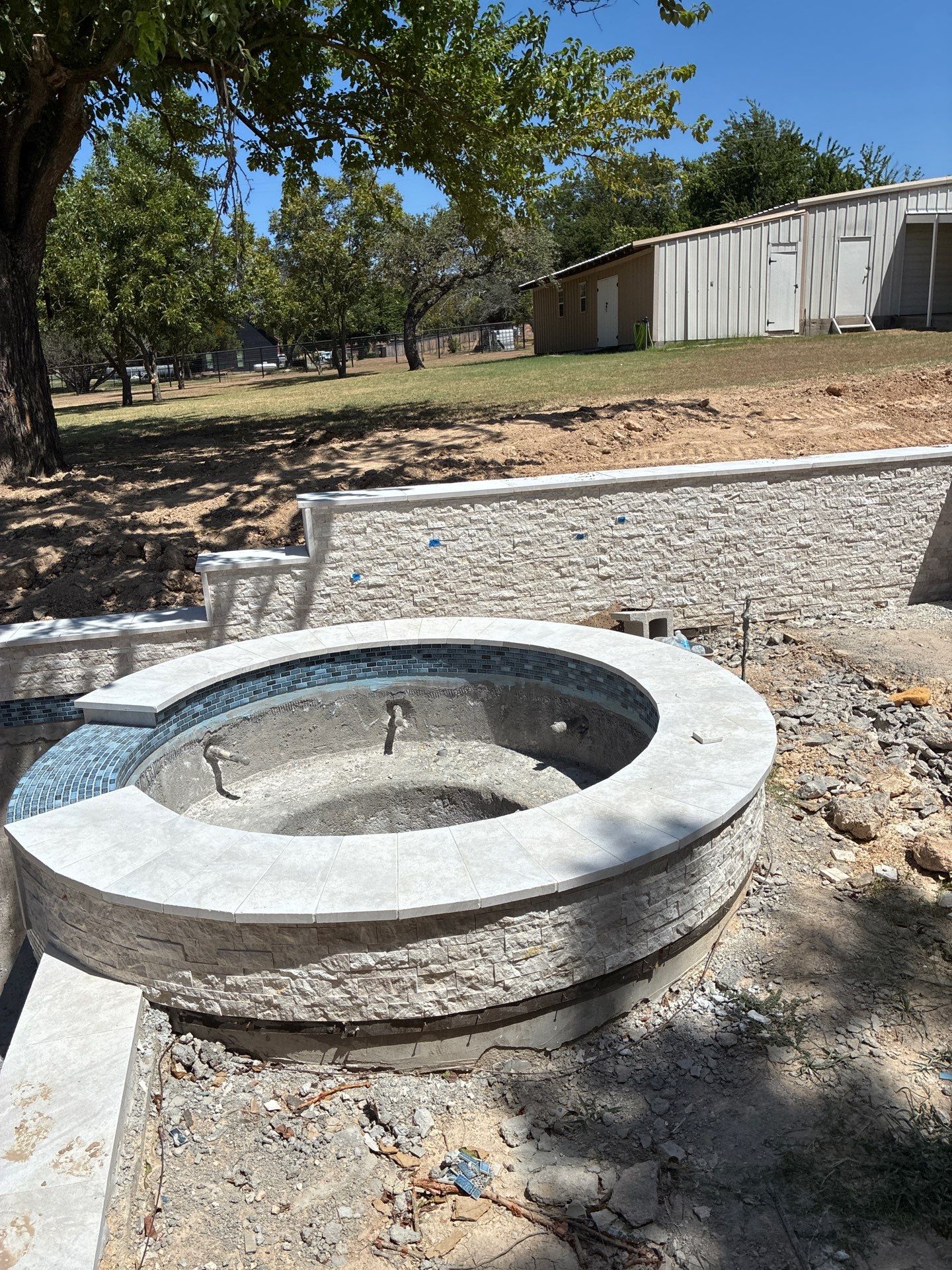 Geometric Pool with Raised Stone Spa by Pinnacle Pools and Spas - DFW