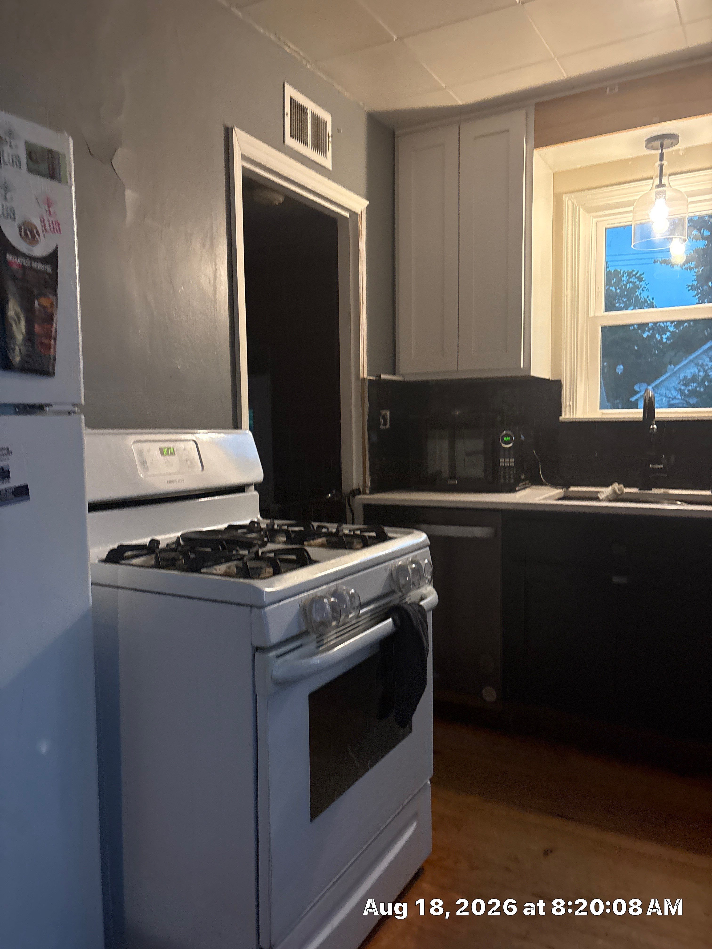 Lincoln Kitchen Renovation Featuring Black and White Shaker Cabinetry by CompanyCam Sales Demo