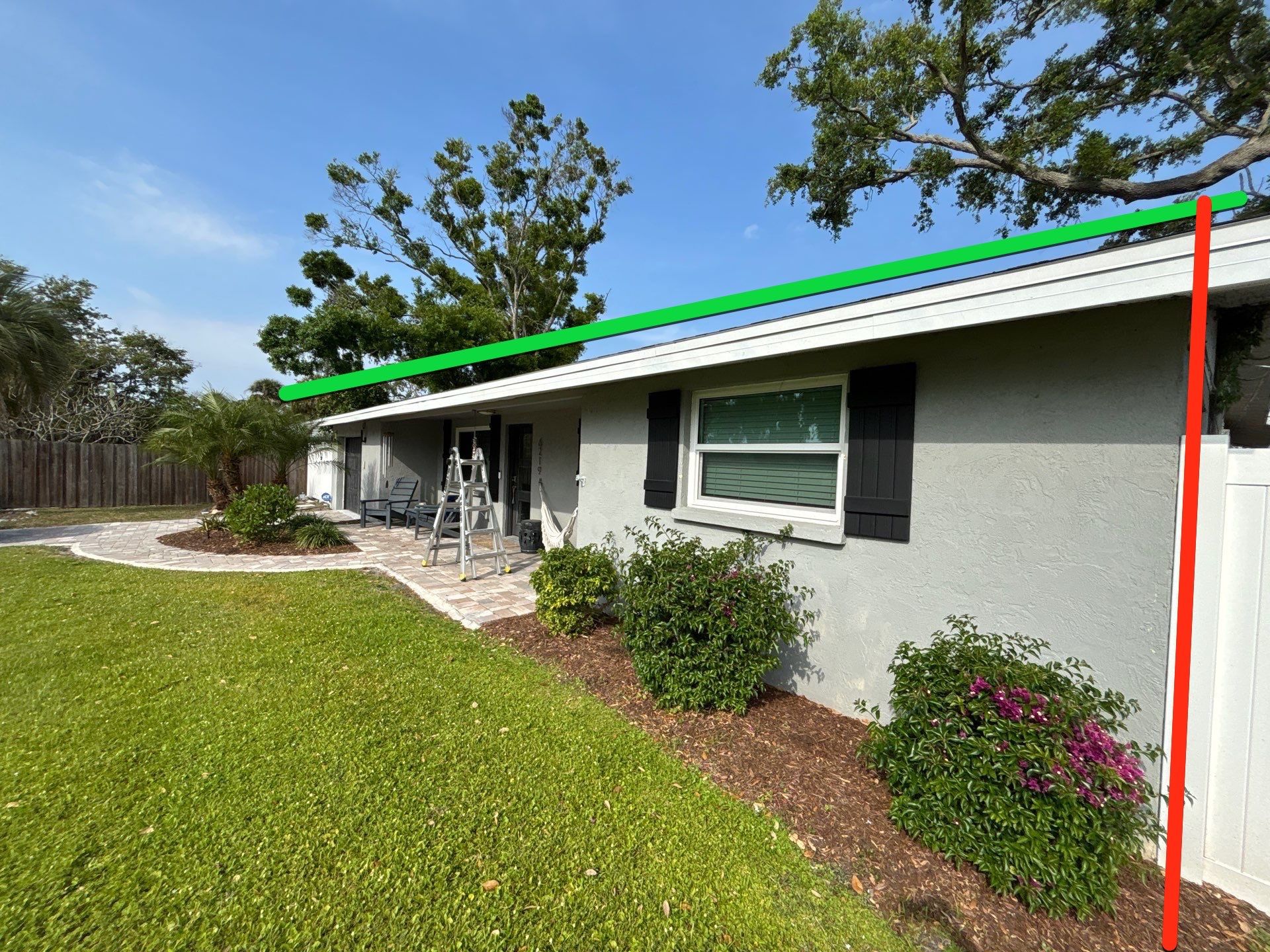 Black Seamless Gutters using 7 inch seamless gutters & New White Soffit in Sarasota FL by Gutter Professors