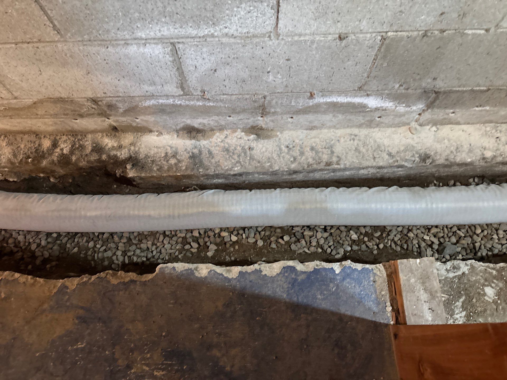 Interior Drain Tile & Buried Discharge in South Minneapolis by Waterproofing Northeast