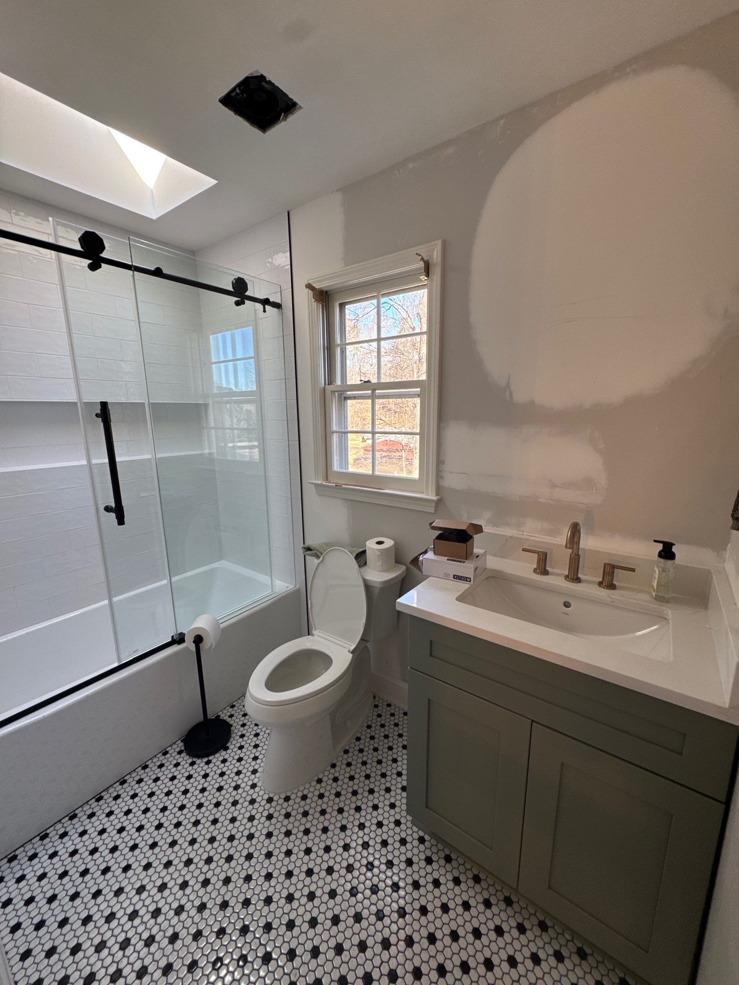 Smyrna Bathroom Remodel Featuring Sage Green Vanity and Hexagonal Tile by Swift Home Renovations