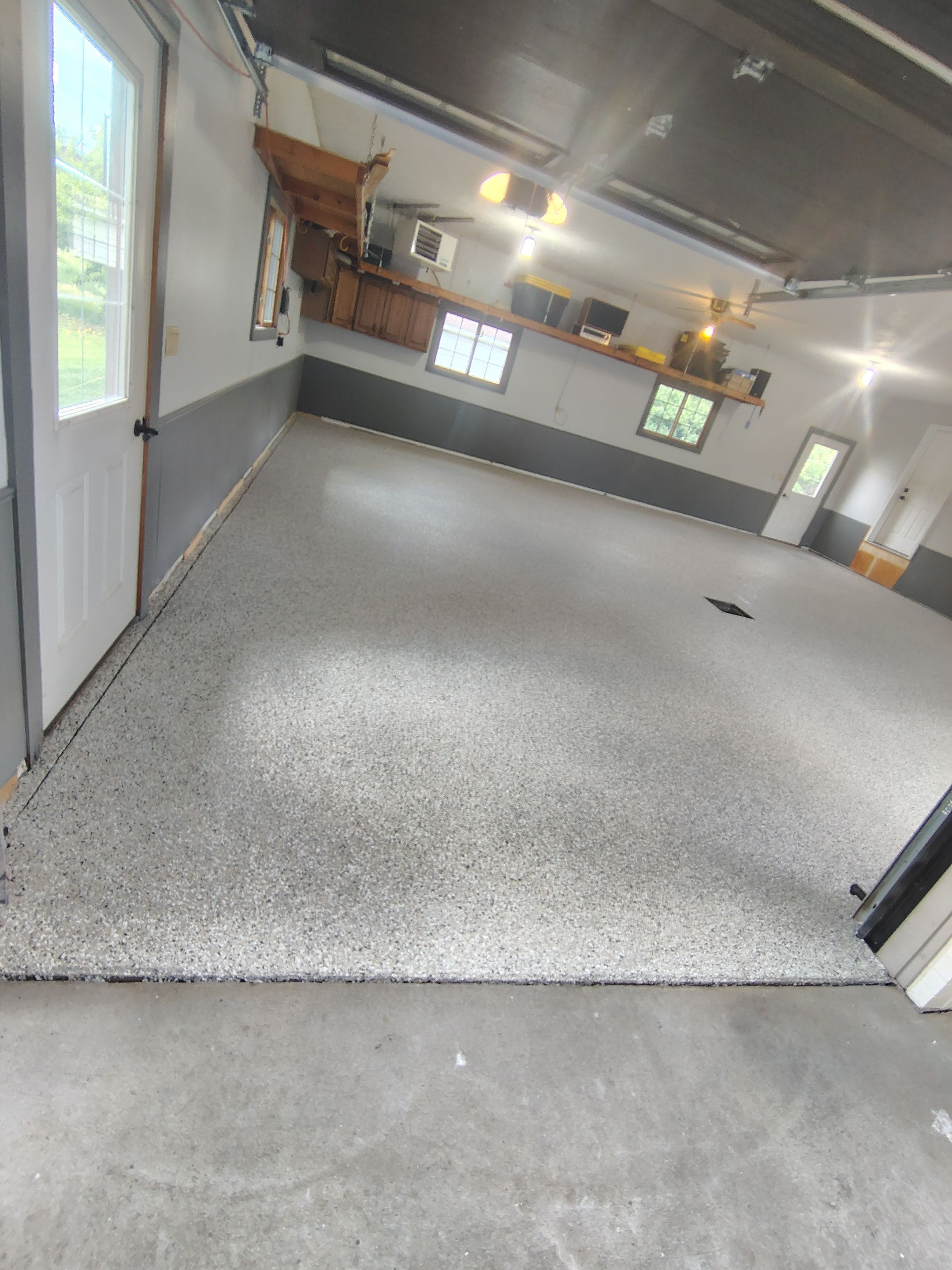 Multi-Fleck Epoxy Garage Floor Coating in Dell Rapids by Select Painting, Coatings & Garage Cabinets