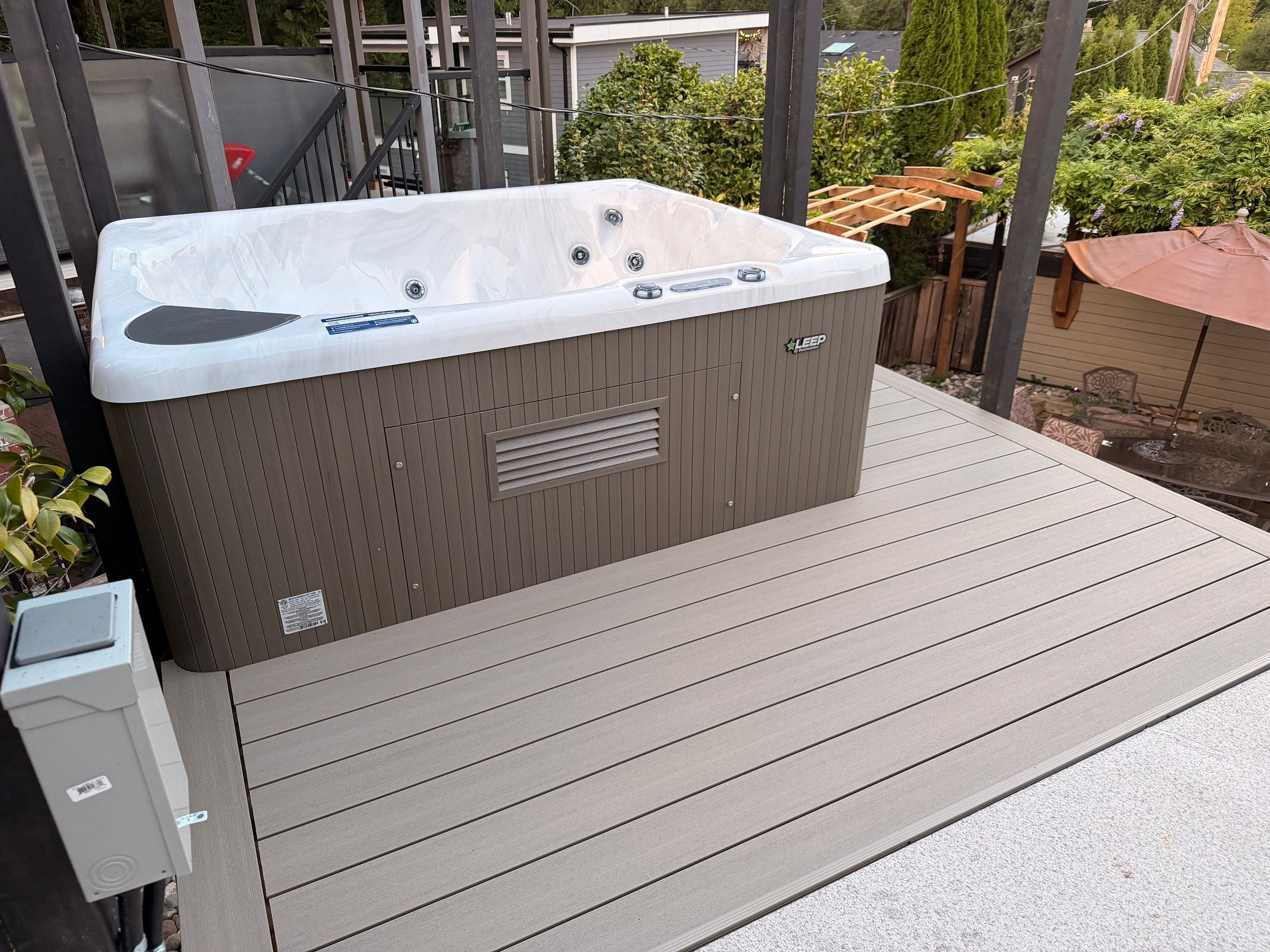 New Composite Deck with glass railing in North Vancouver by YVR Construction Group