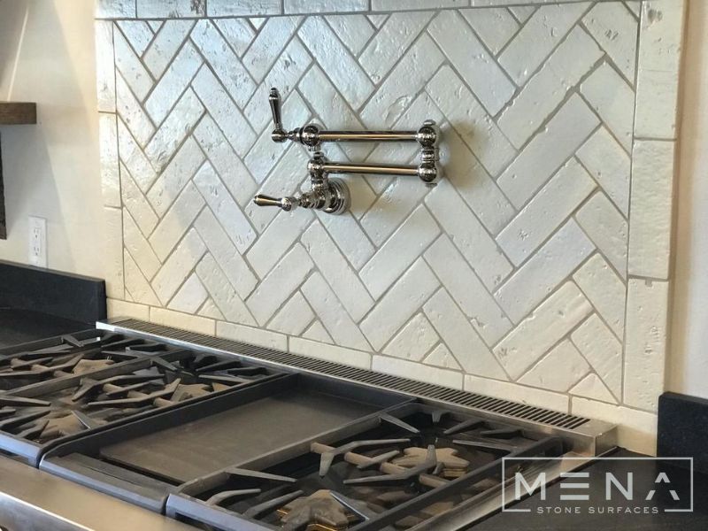 Kitchen, outdoor kitchen and pool brick floor installation by Mena stone surfaces
