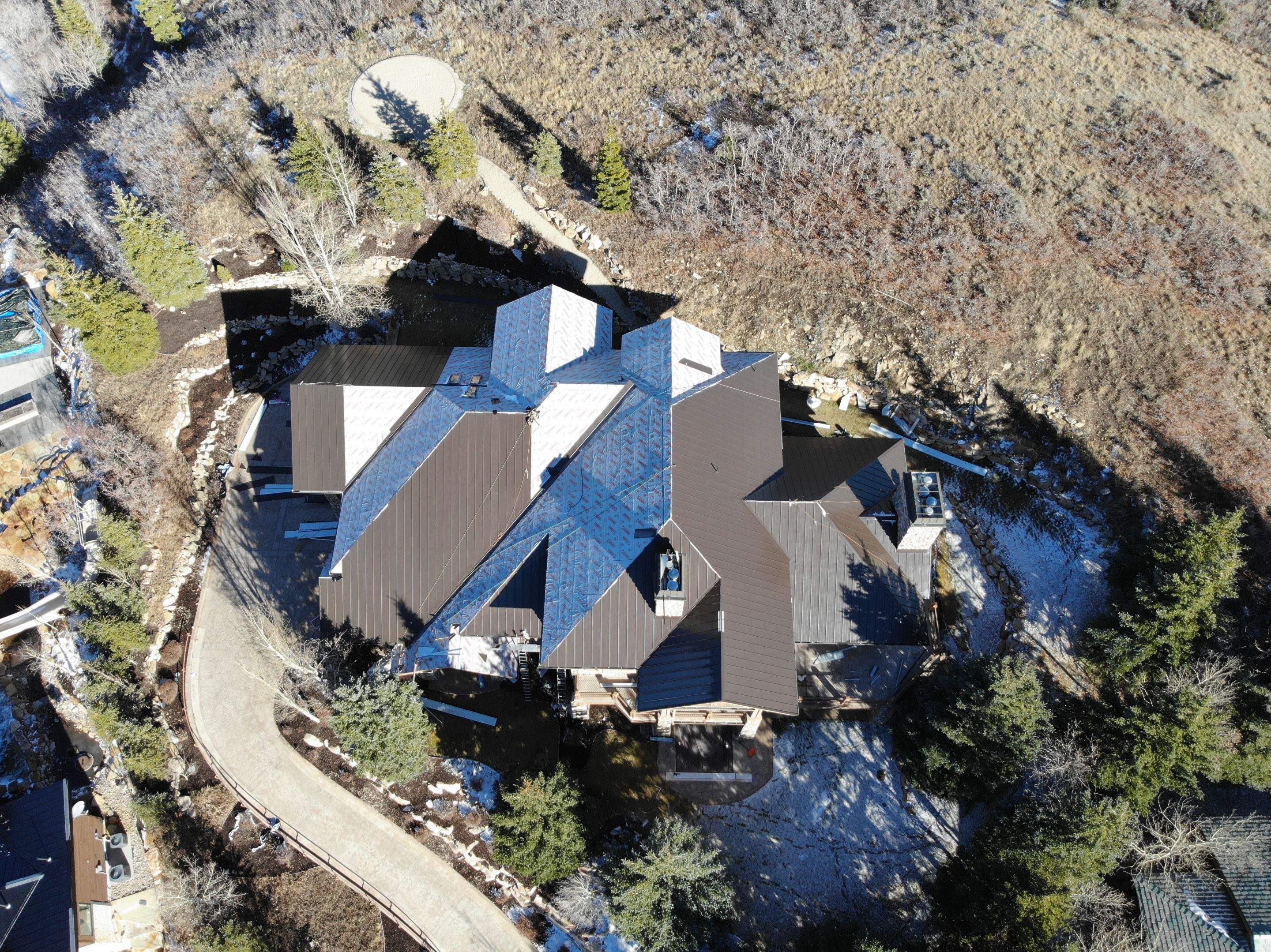 Standing Seam Metal Roof Replacement After Snow Damage by ASAP Roofing & Restoration