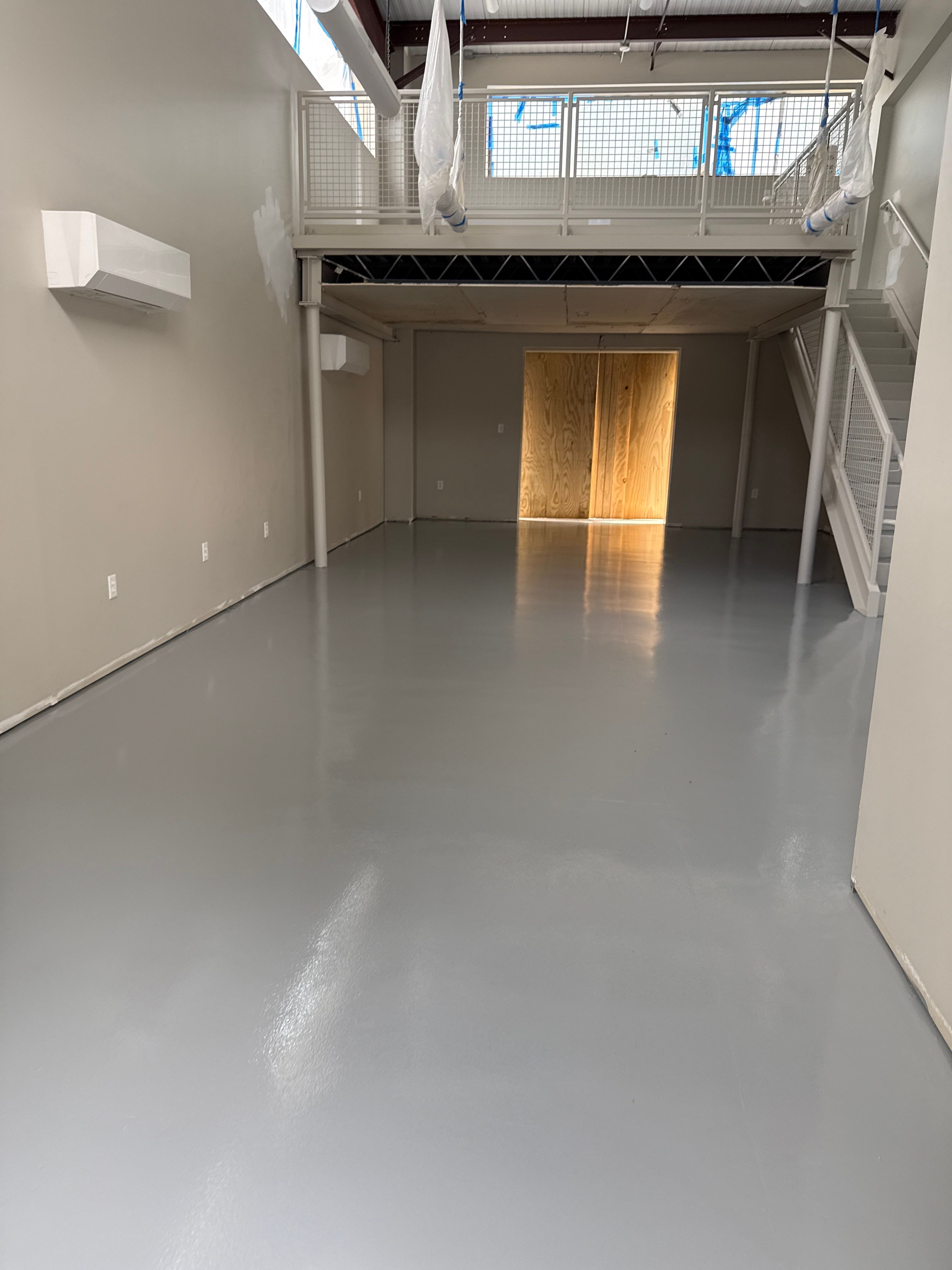 Industrial Epoxy Flooring for Sandhill Crane Workshop in Gautier by Cornerstone Hard Surface Restoration 