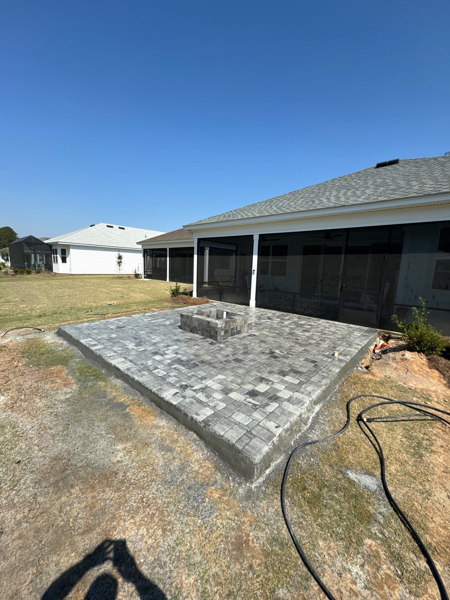 Custom Grey Paver Patio and Square Fire Pit in Hardeeville by Lowcountry Scapes, LLC