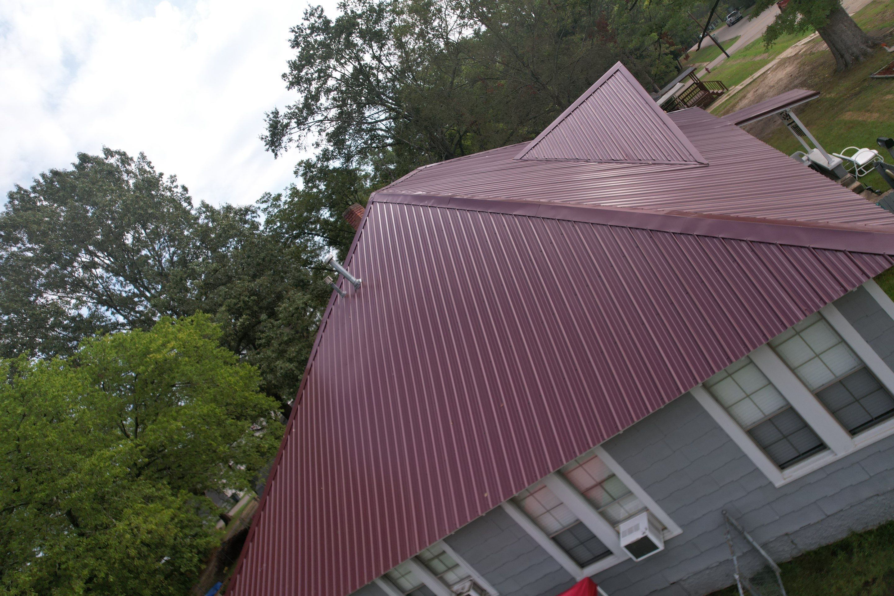 Residential Metal Roof Replacement using Reed's Metals: Colored Residental Panel (Burgundy) by Hostetler Roofing