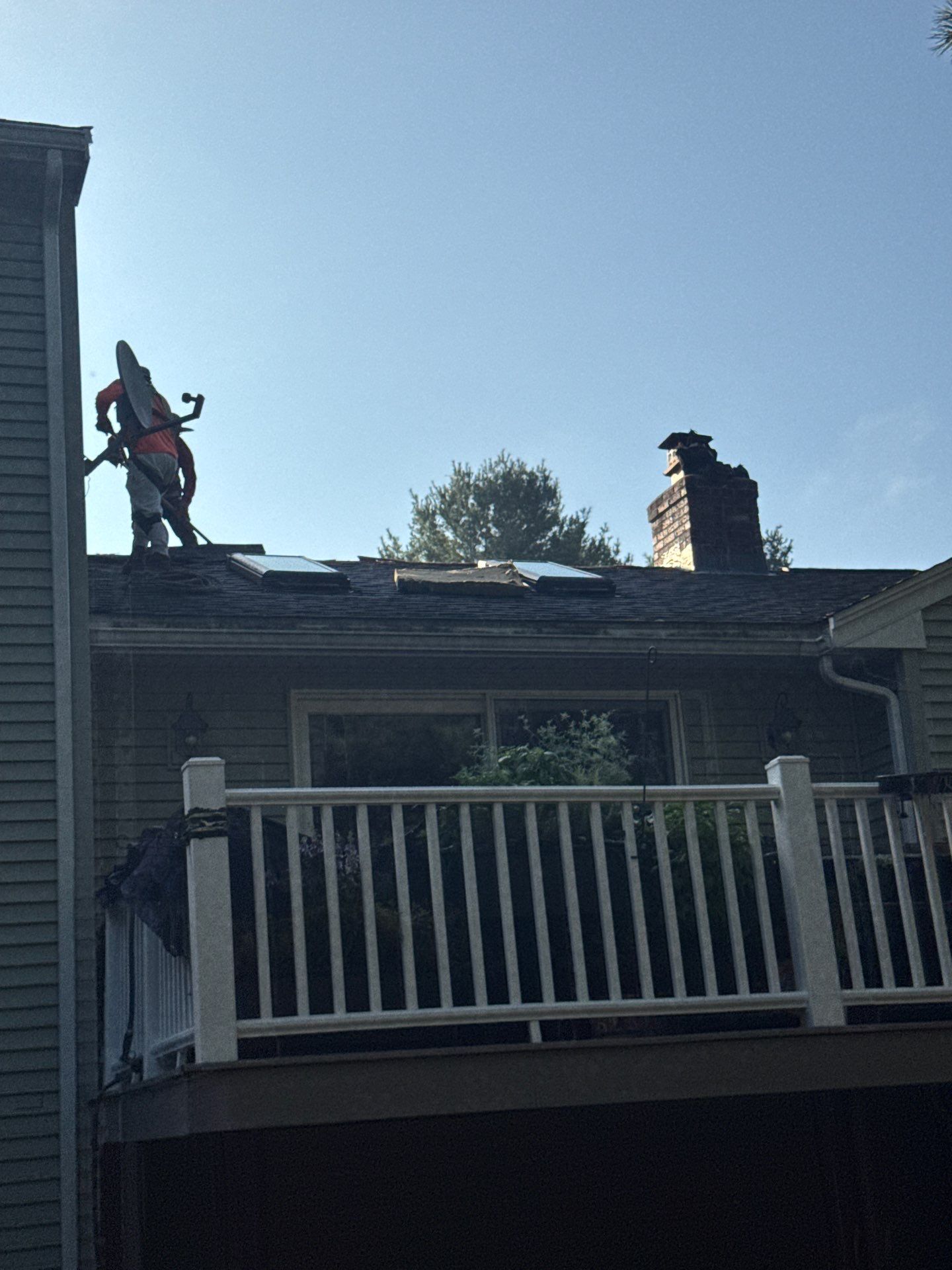 Complete Roof Replacement with Chimney Flashing, Gutter Guard System, and Vinyl Siding Repairs by Mighty Dog Roofing of Greater Middlesex County