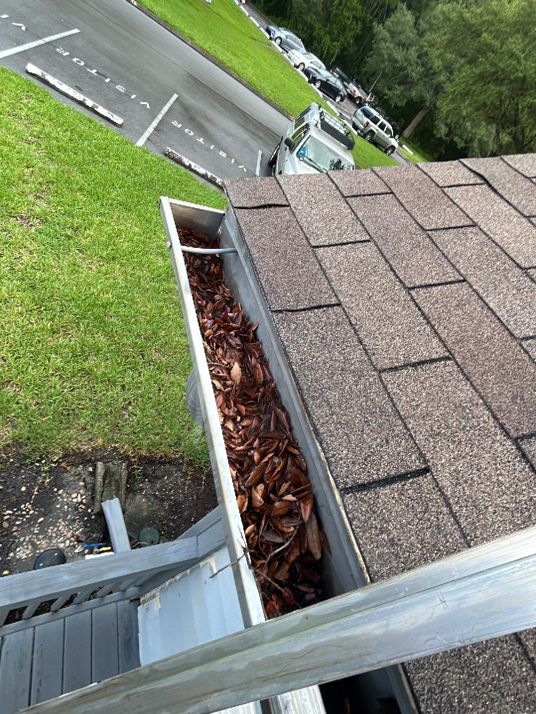 HOA gutter cleaning in Pinehurst & Southern Pines, NC,before  photo showing full gutters.