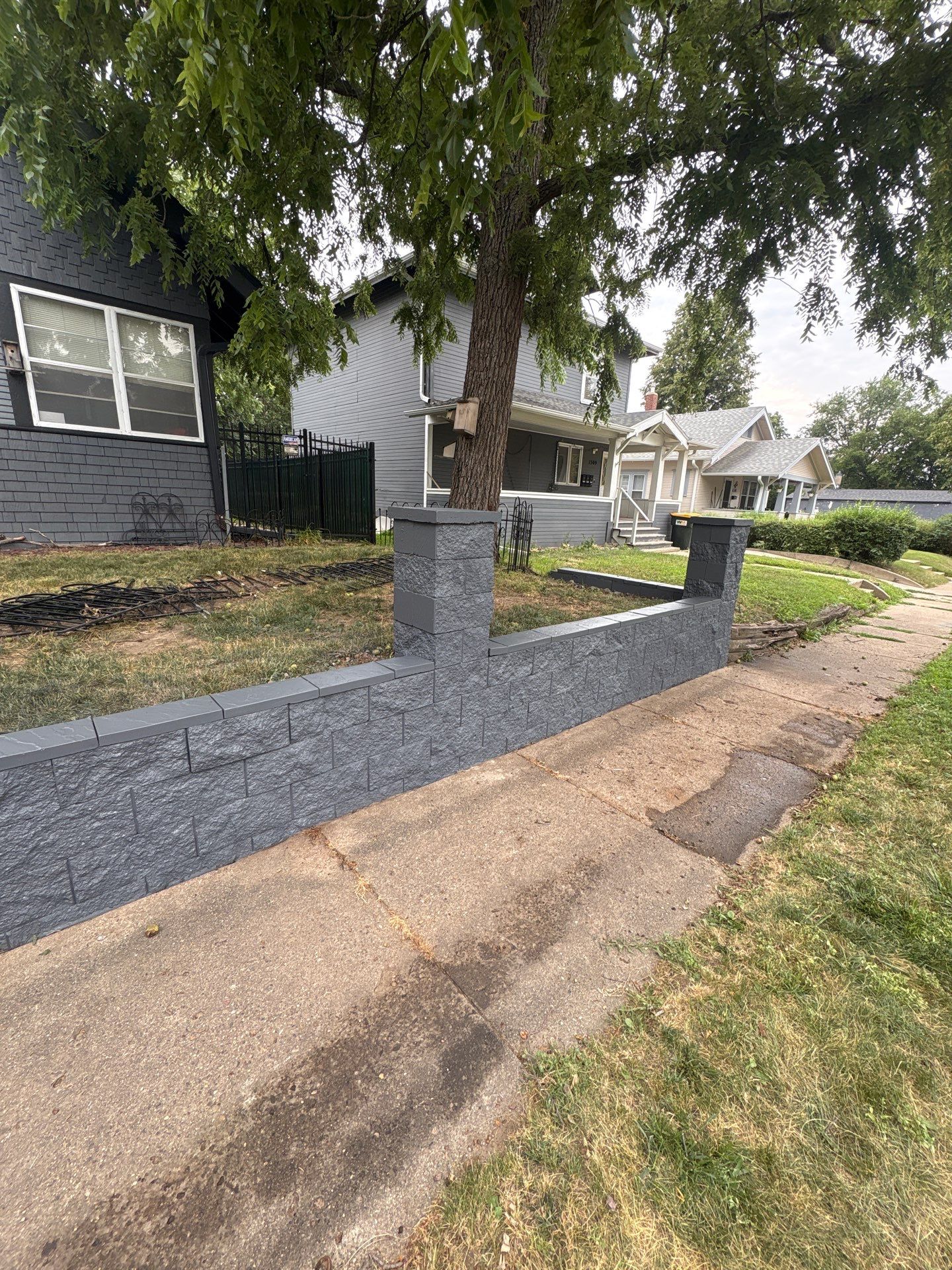 Exterior Masonry Painting for a Sioux Falls Retaining Wall by Select Painting, Coatings & Garage Cabinets