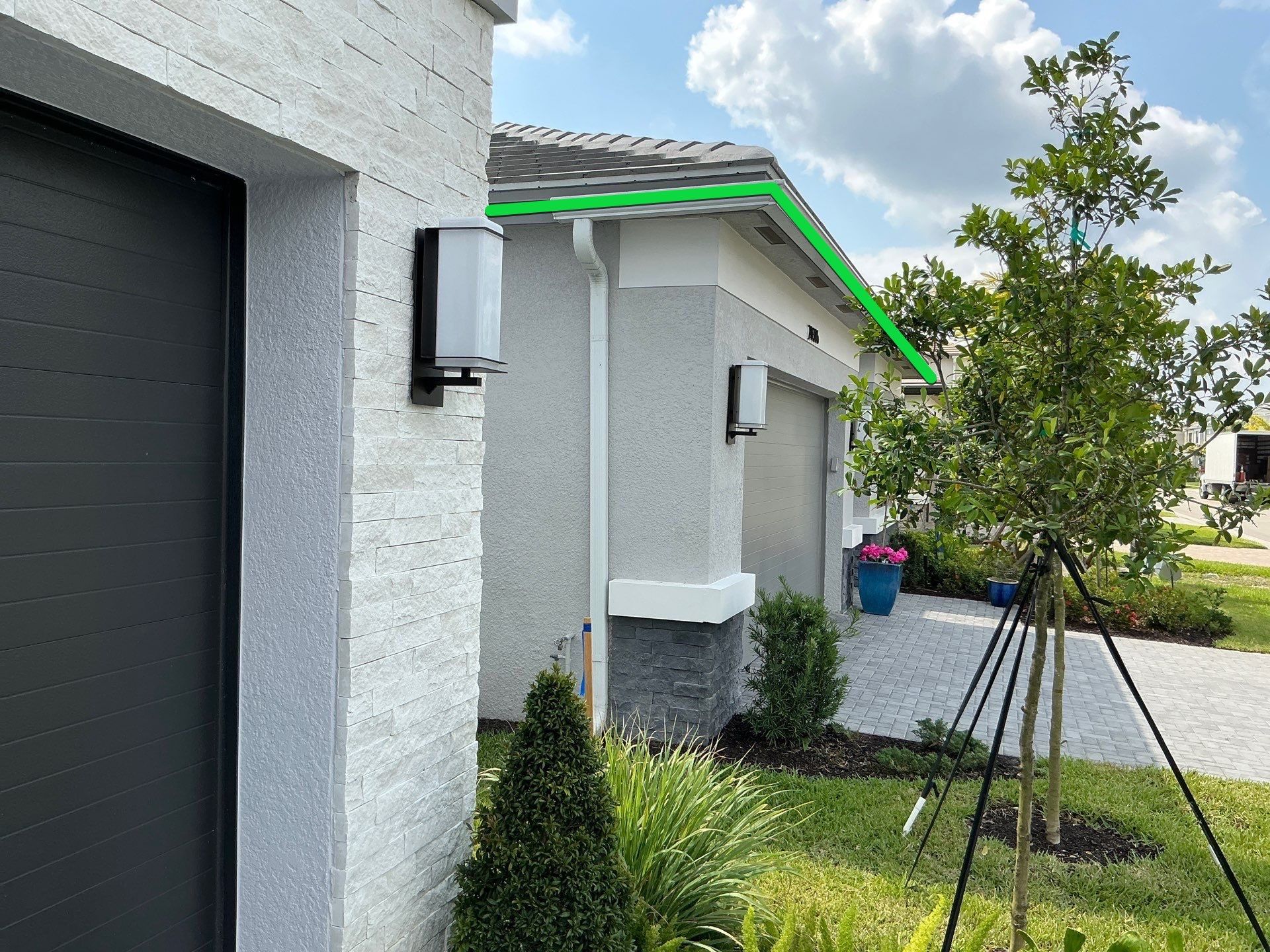 Grey Seamless Gutter Installation in Estero FL by Gutter Professors